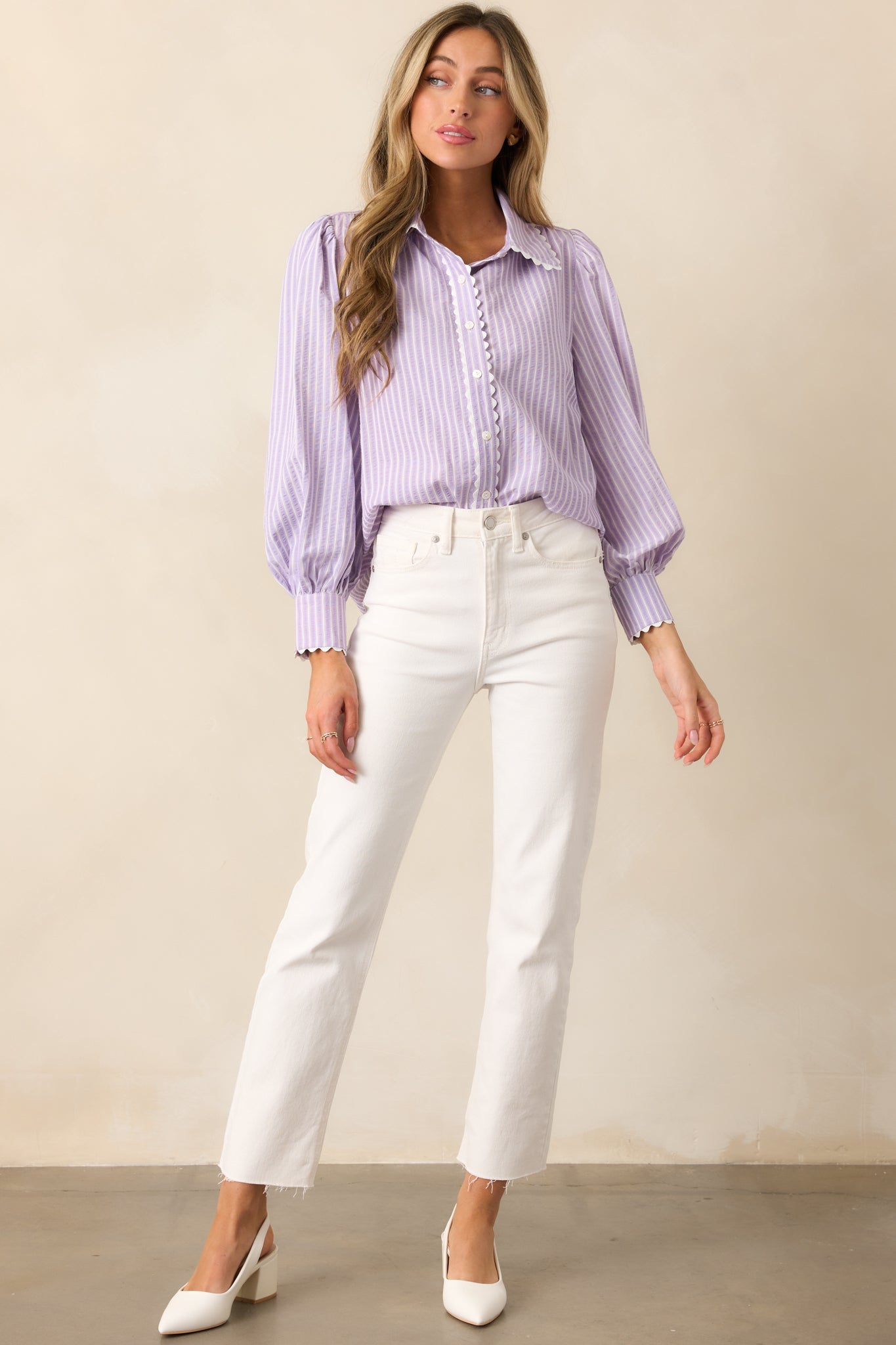  Classic and versatile, this lavender blouse features long sleeves with cuff detailing and playful ricrac trim.