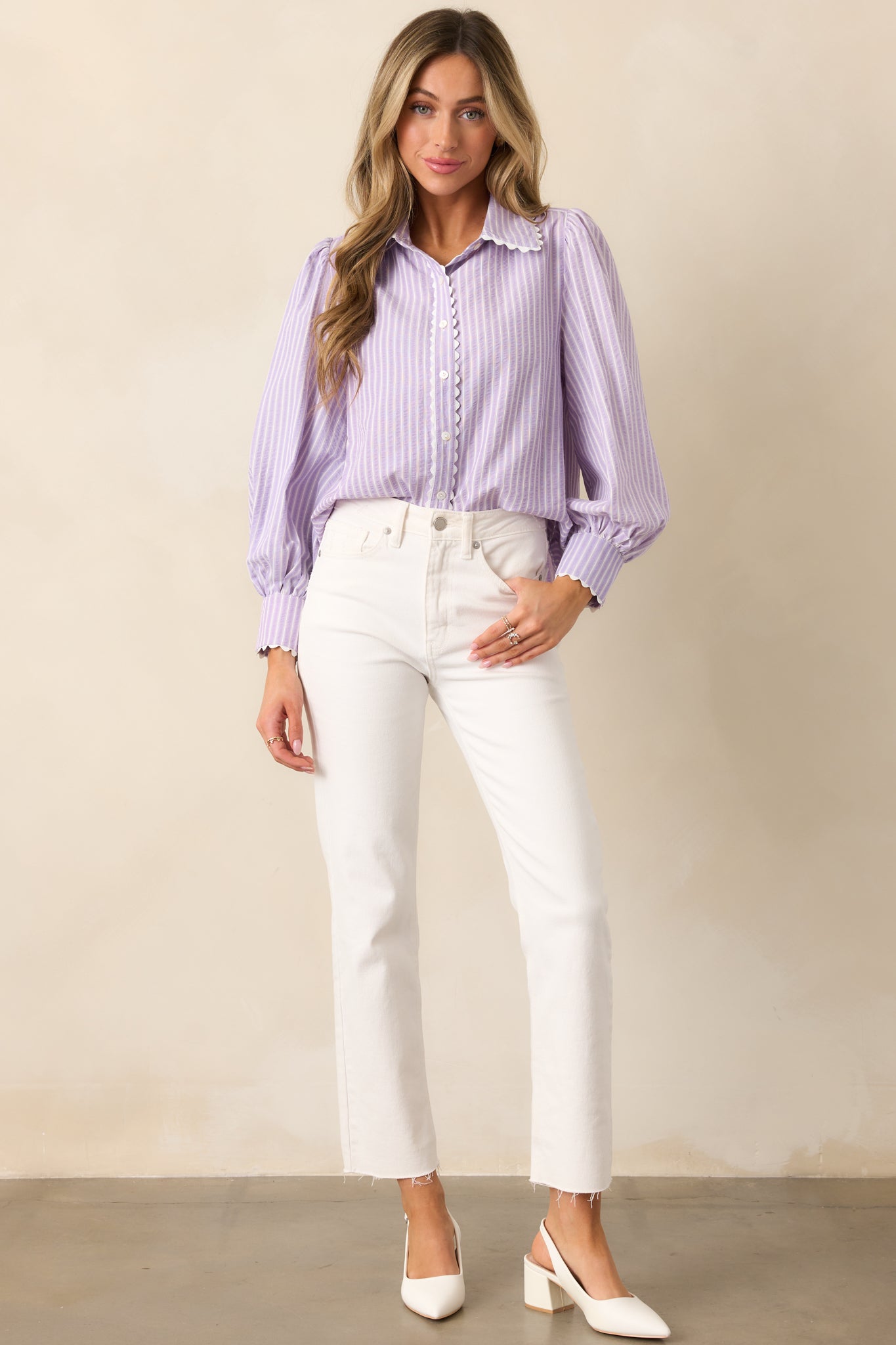 A stylish lavender blouse with a collared neckline, button front design, and a subtle striped print for a polished look.