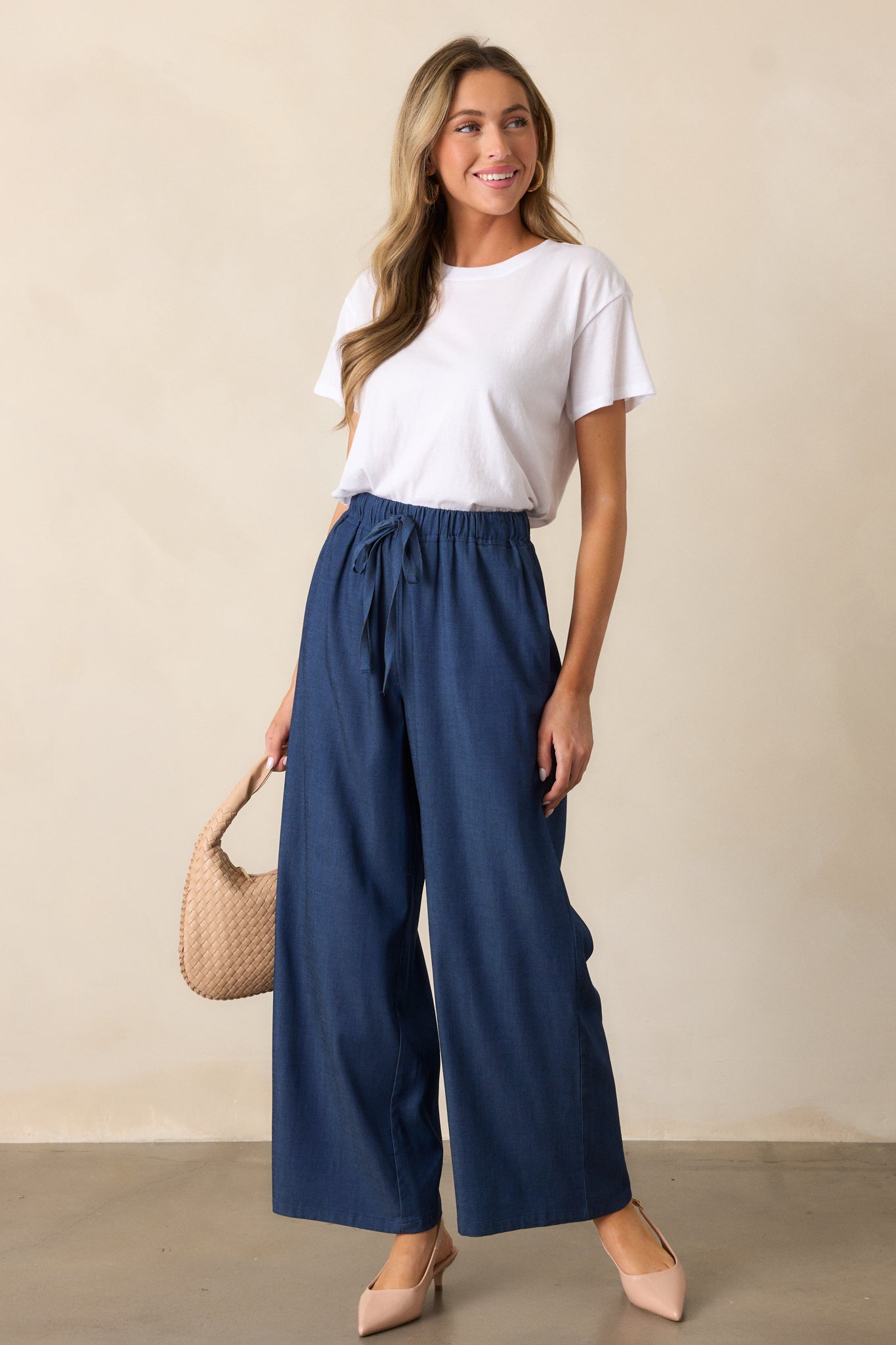 A close-up crop of the wide leg design, showcasing the flowing chambray fabric and relaxed silhouette.