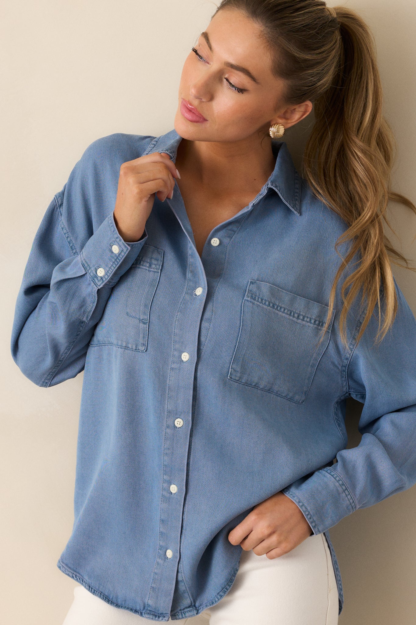 A closer look at the chambray top’s button front and two chest pockets.