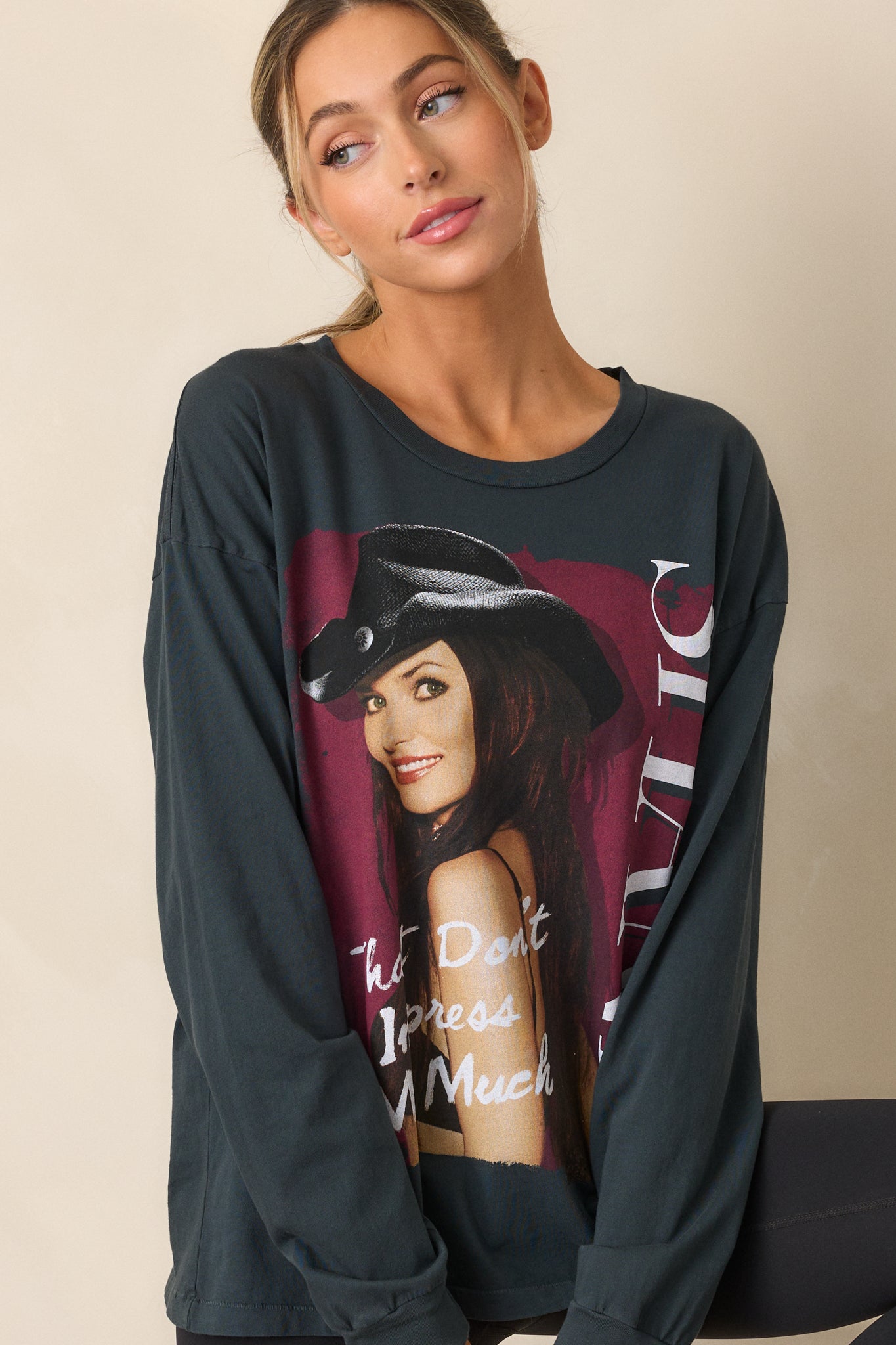 Close-up crop highlighting the details of the Shania Twain 'That Don't Impress Me Much' photo graphic on the front of the tee.