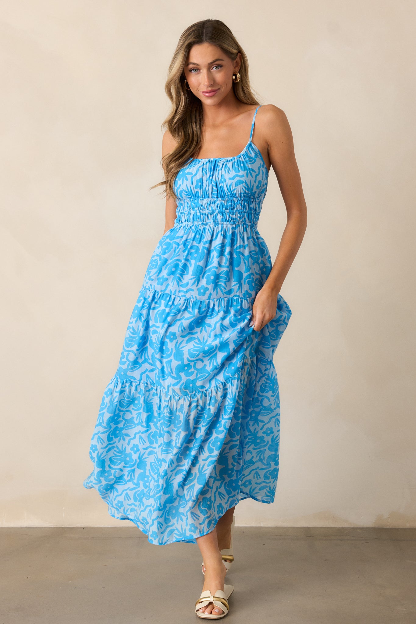  Full-body shot of the blue maxi dress, emphasizing the relaxed fit and the lightweight, tiered design that adds movement to the silhouette.