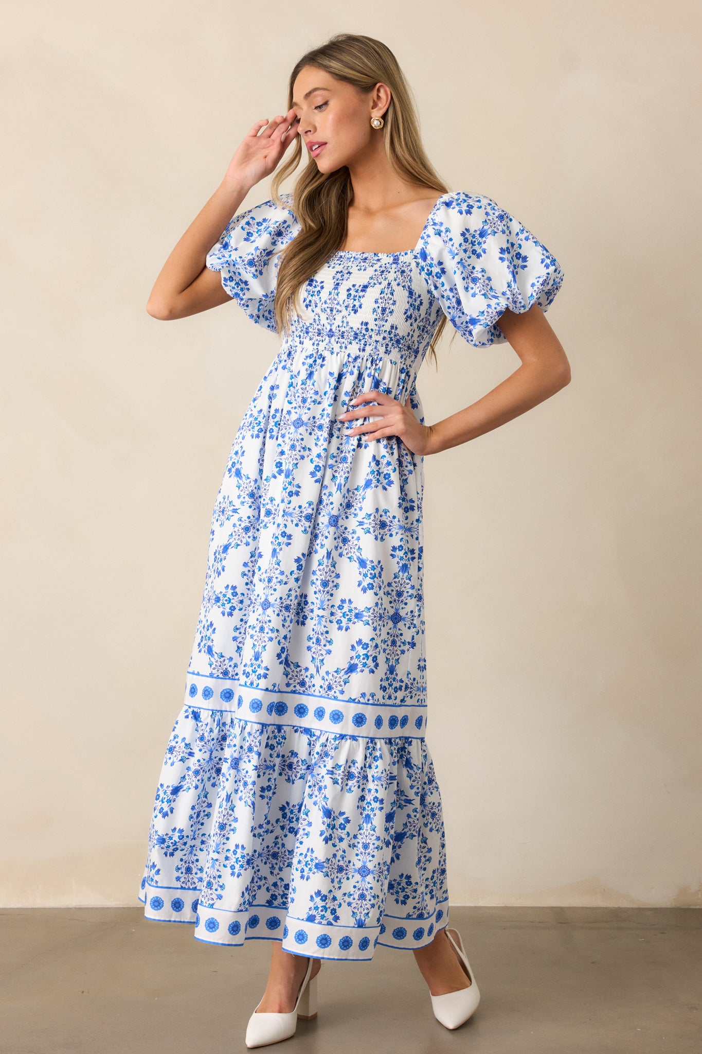 The royal blue maxi dress in a full-length photo, emphasizing the square neckline, smocked top, and flowing skirt.