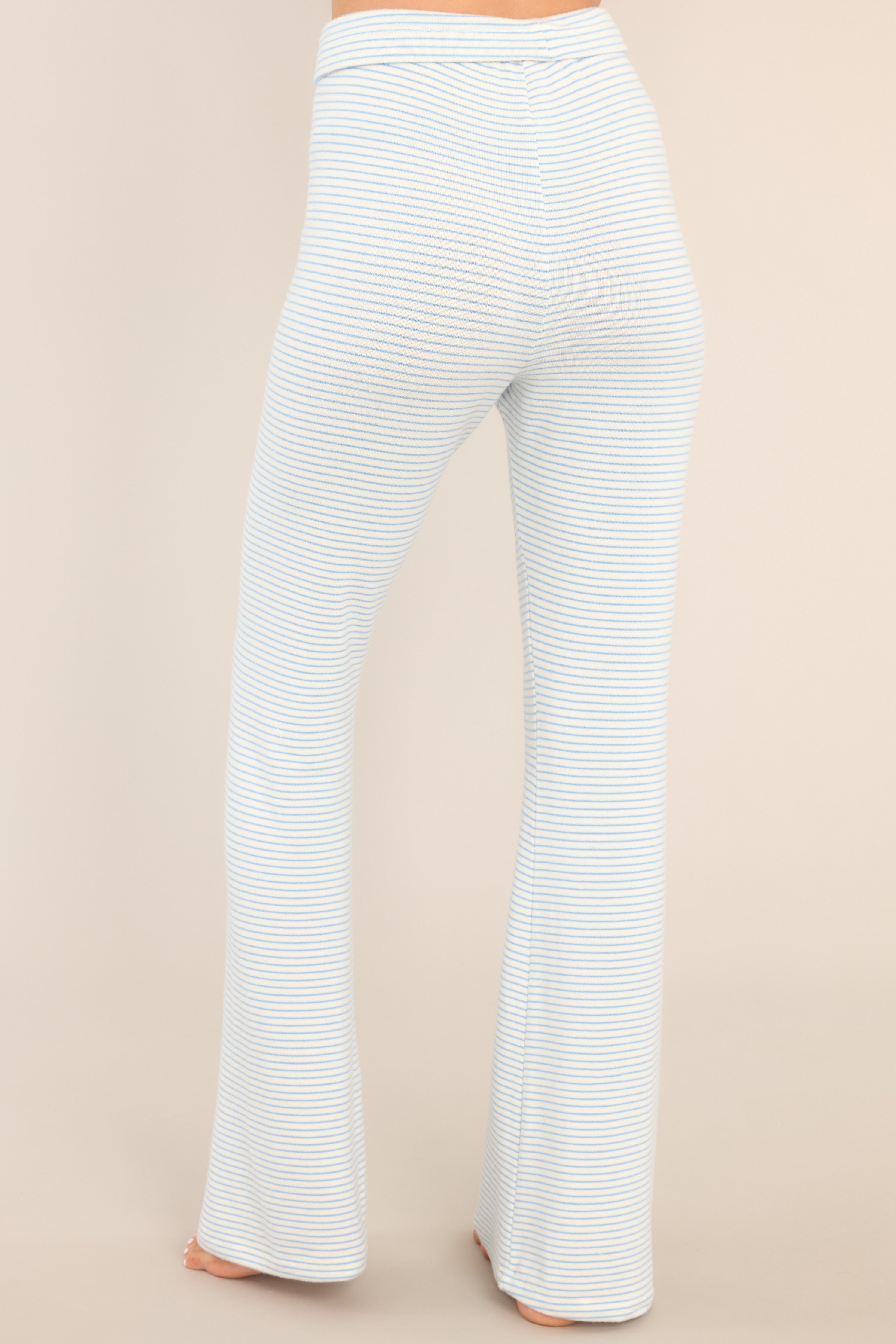 Back view of Z Supply blue and white  horizontally striped lounge pants with an elastic waistband and tie.