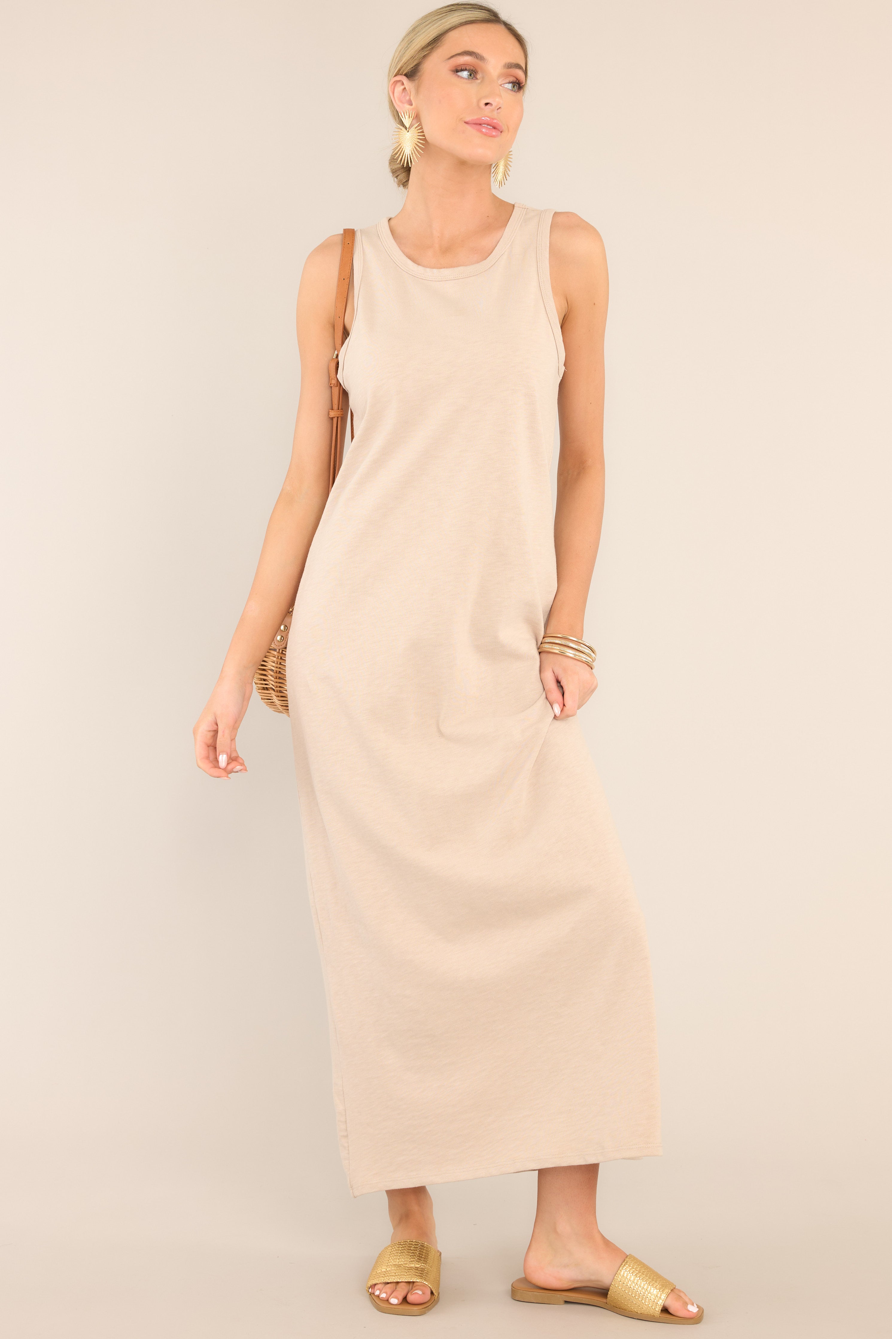 Front view of  this dress that features a crew neckline, a straight silhouette, and a slightly stretchy cotton material that gives it a relaxed fit.