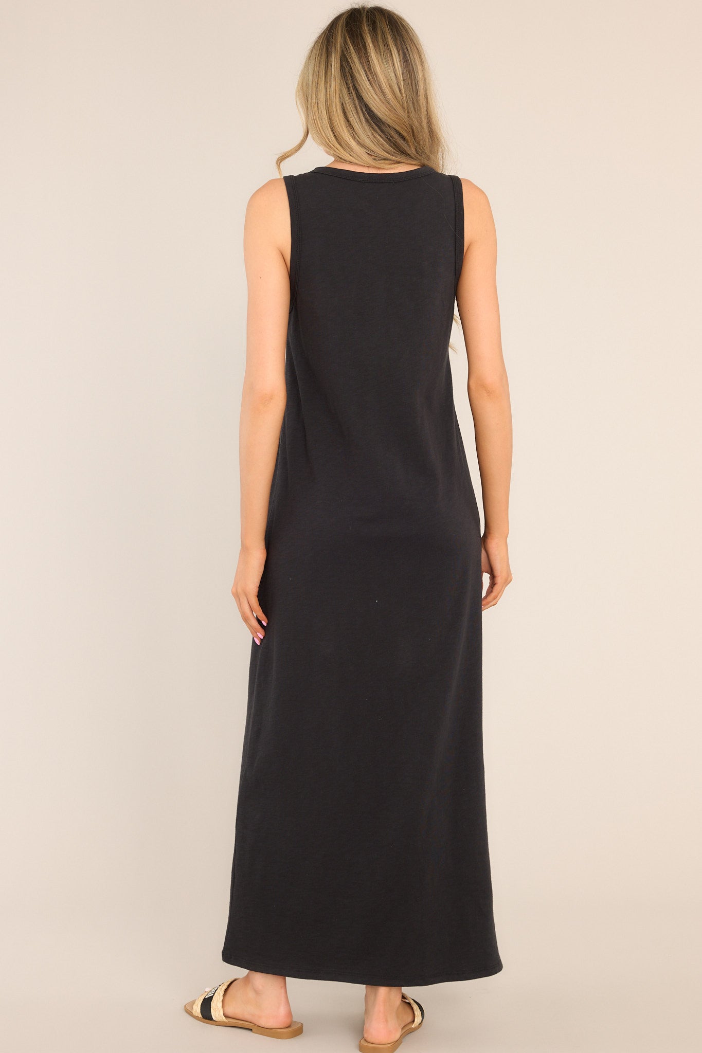 Back view of this dress that features a crew neckline, a straight silhouette, and a slightly stretchy cotton material that gives it a relaxed fit. Belt is not included.