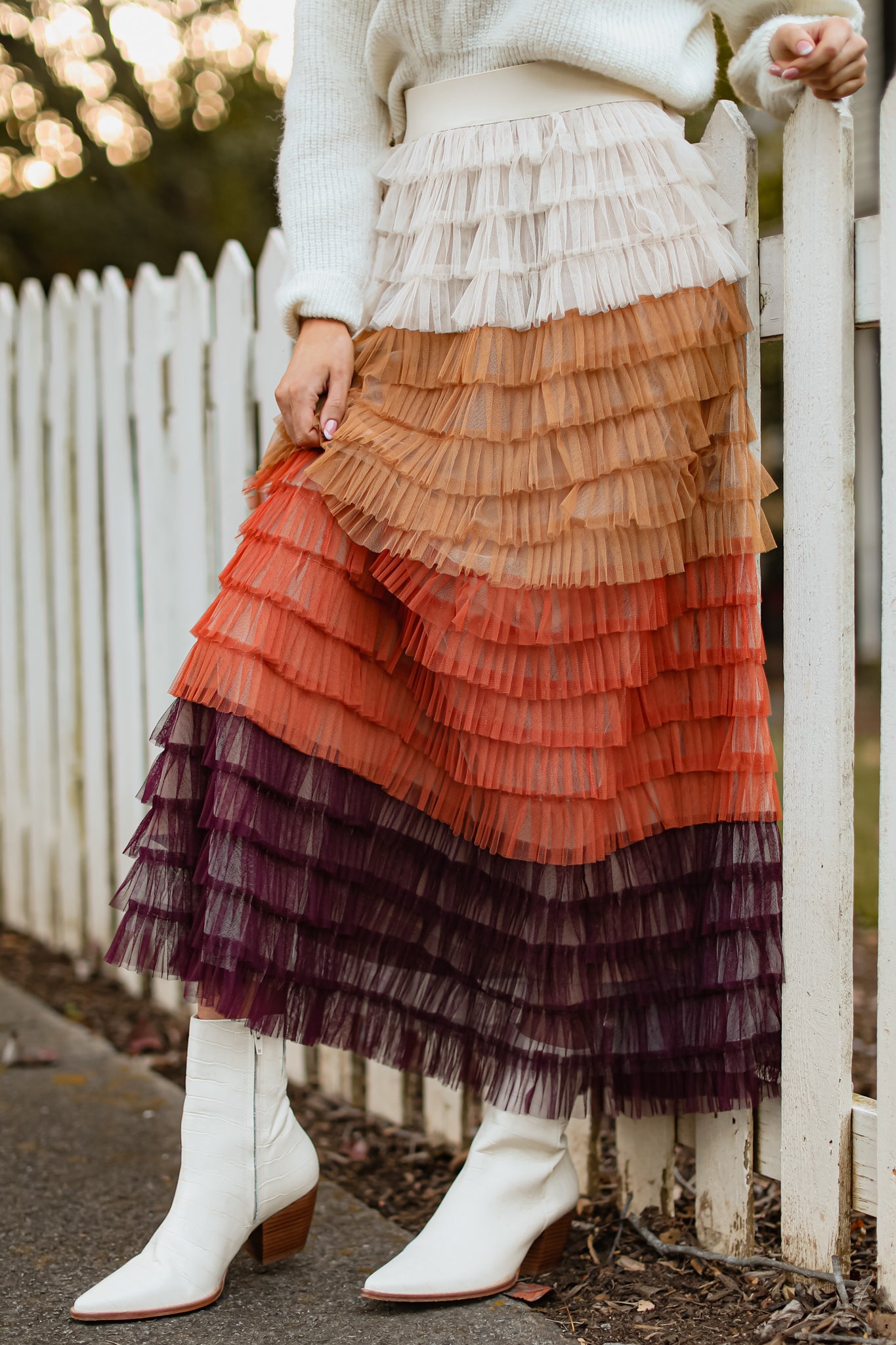 Front view of this skirt that features a high waist design, an elastic waistband and ruffle tulle detailing throughout.