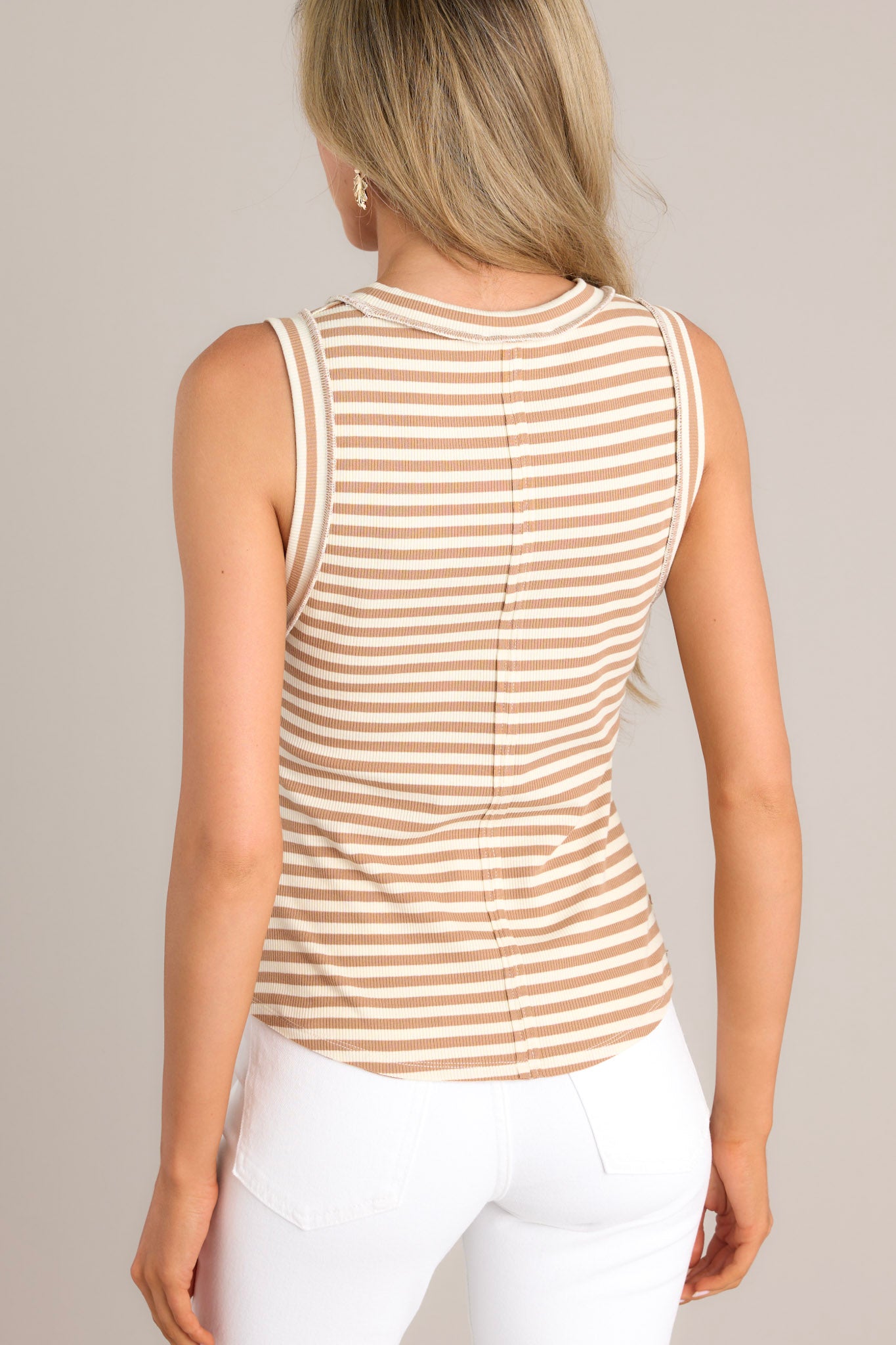 Back view of this tank that features a ribbed scoop neckline, a classic stripe pattern, a ribbed texture, and a scoop hemline.