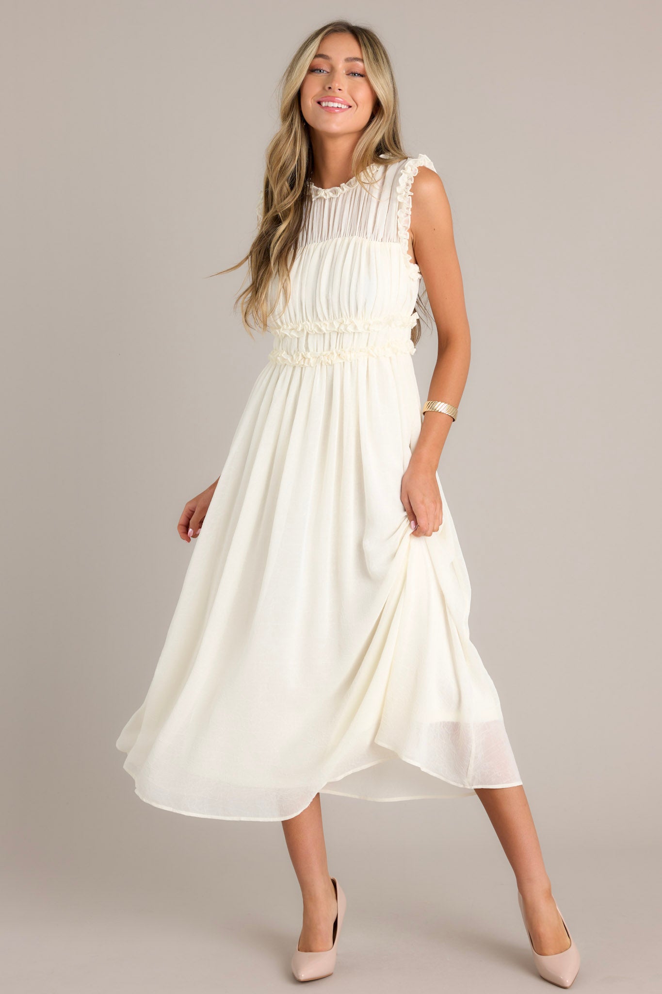 Elegant ivory dress with a high neckline, ruffles on the bust, and a back zipper, complete with a keyhole opening at the back.