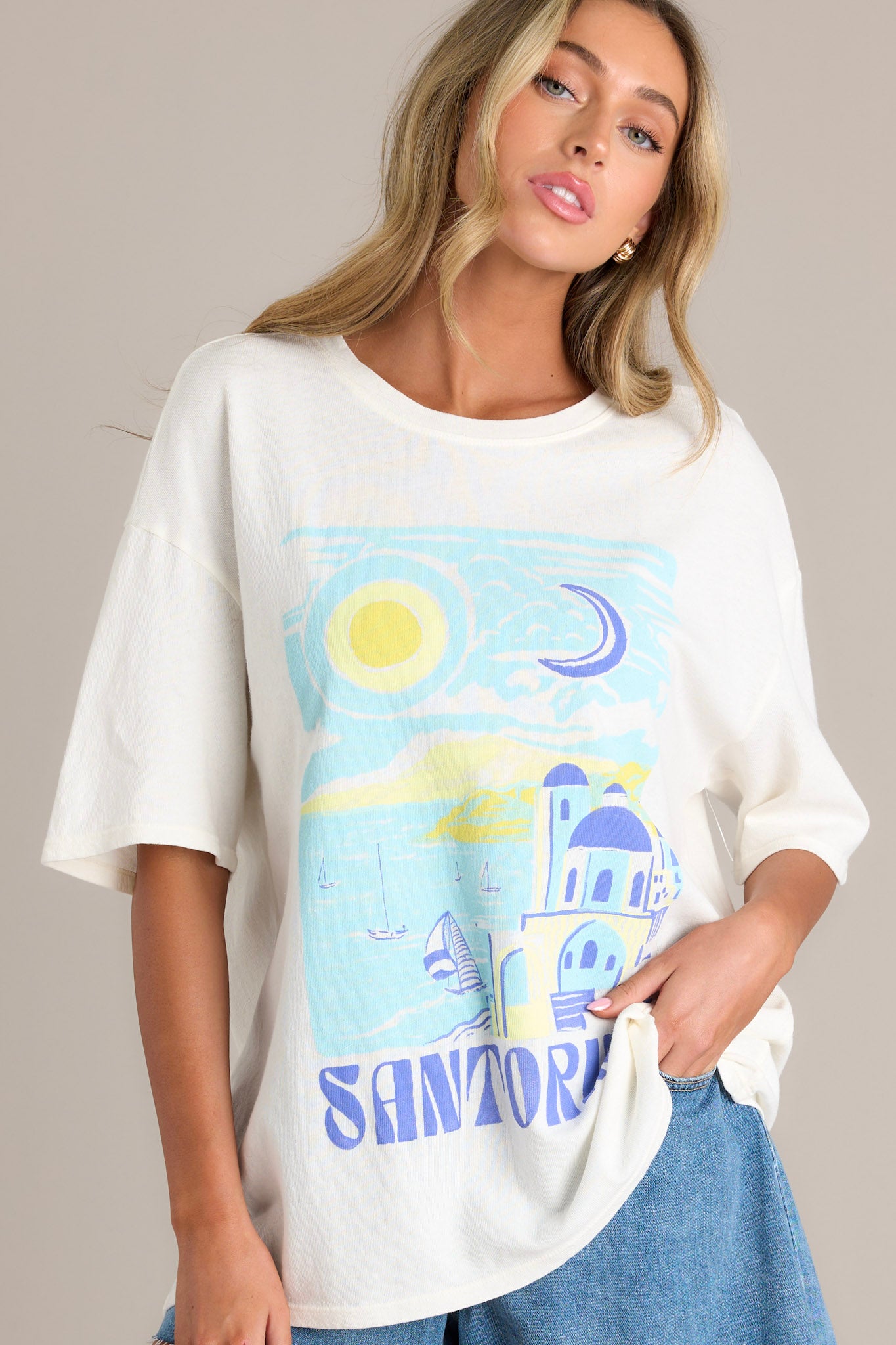 Front angled view of a tee featuring a crew neckline, a washed graphic, and an oversized fit