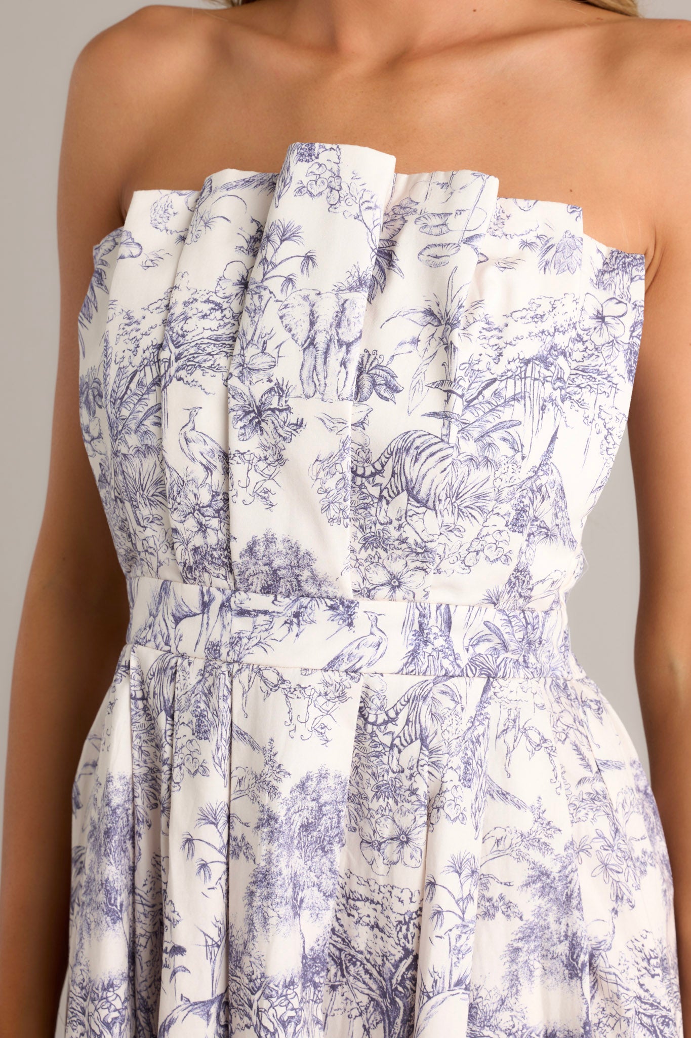 Close up detail of the strapless, structured bodice with a slightly pleated design. 