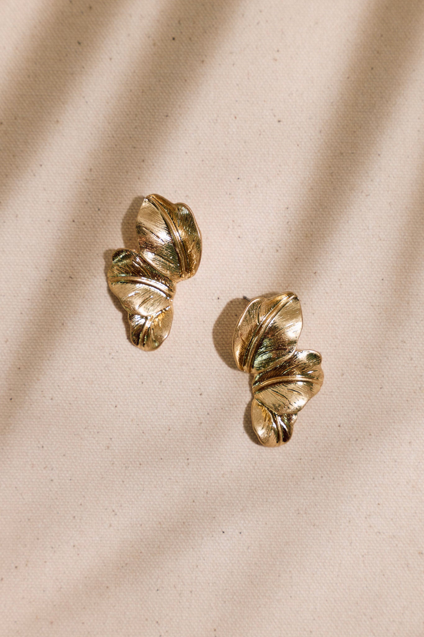 Tropical Enchantment Worn Gold Palm Leaf Earrings