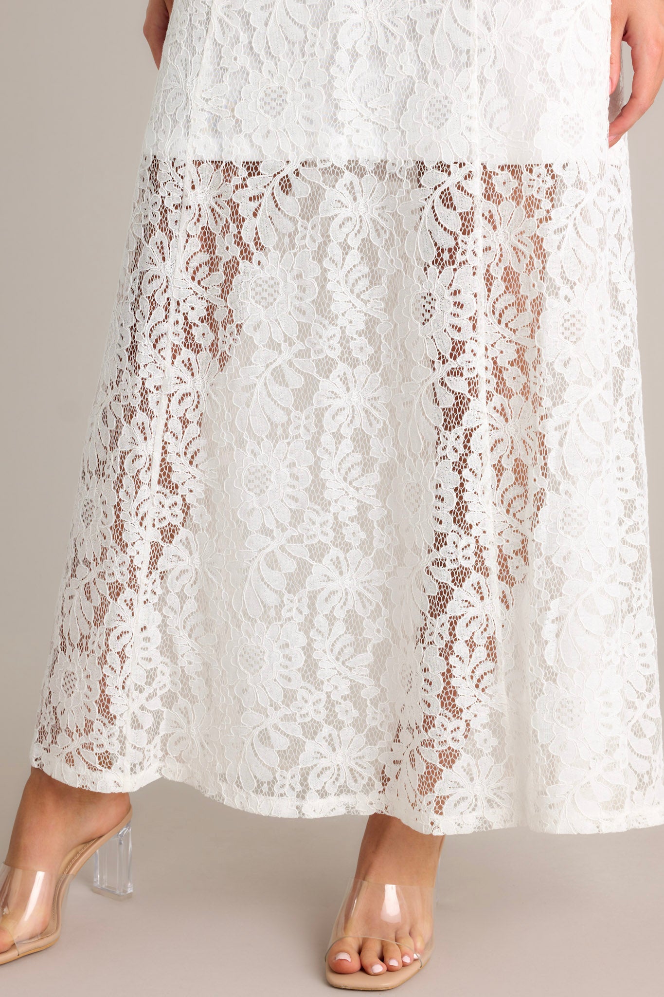 Close-up of the dress showing the  lace overlay, and side slit.