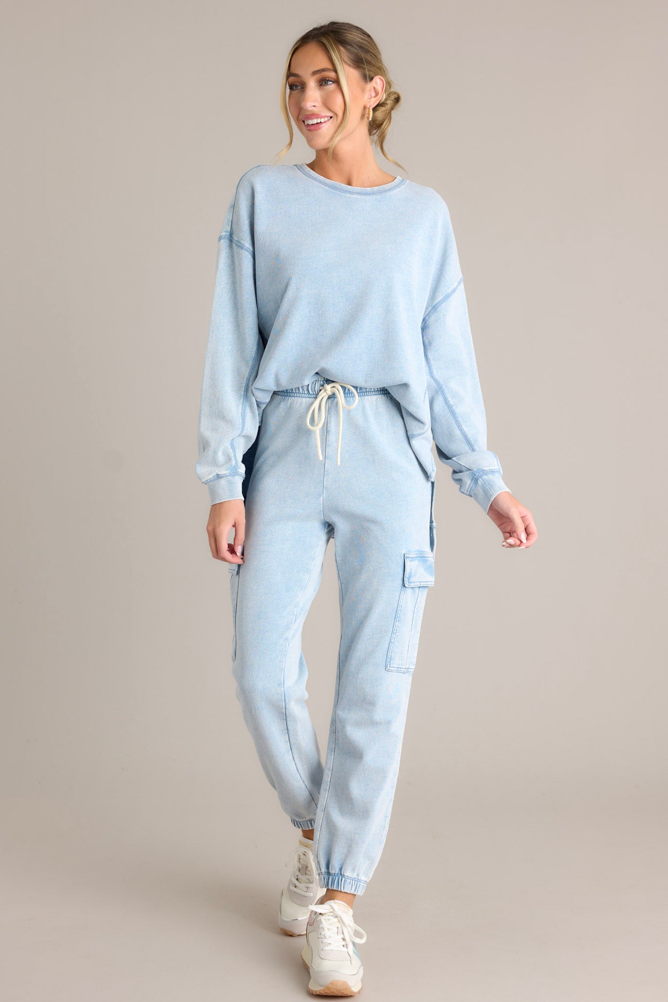 Front view of these joggers that feature an elastic waistband with a self-tie drawstring, large side pockets, a washed design, and elastic cuffed ankles.