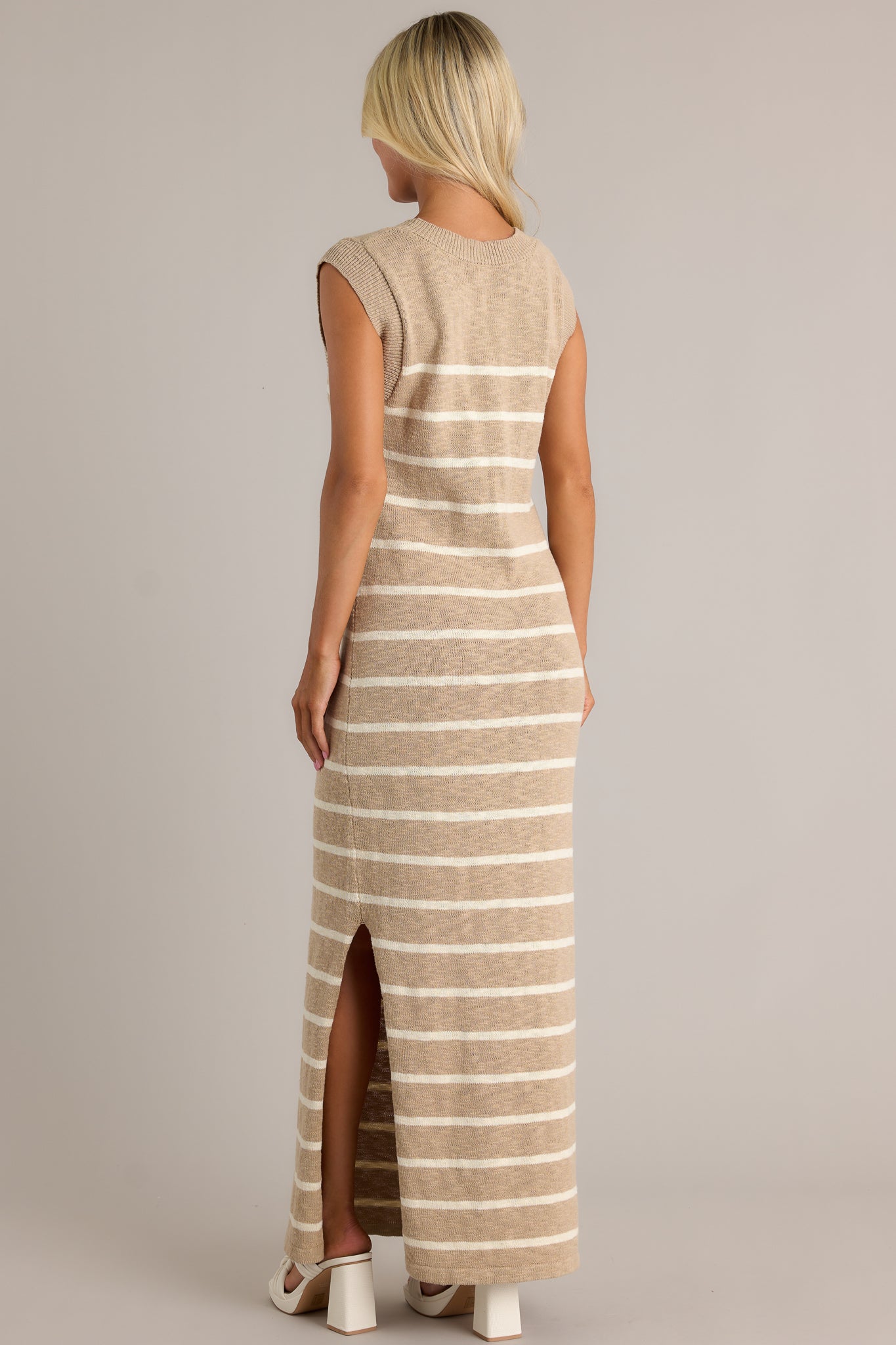 Back view of a taupe dress highlighting the overall fit and the lightweight knit fabric.