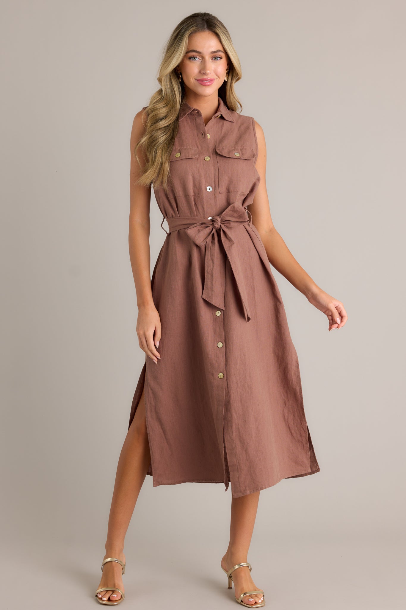 Front angled view of a midi dress featuring a tie-front belt and a button-front design