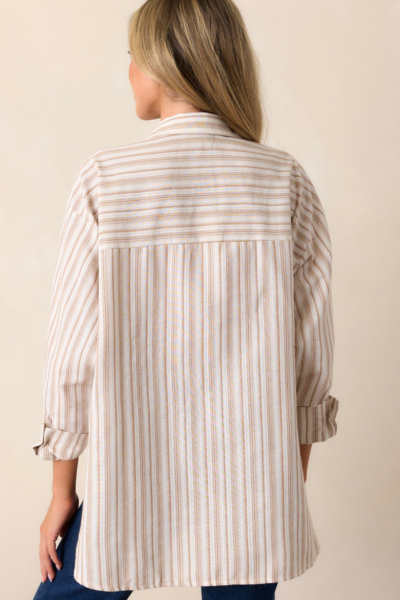 Back view of a top highlighting the overall fit and the delicate ivory color.