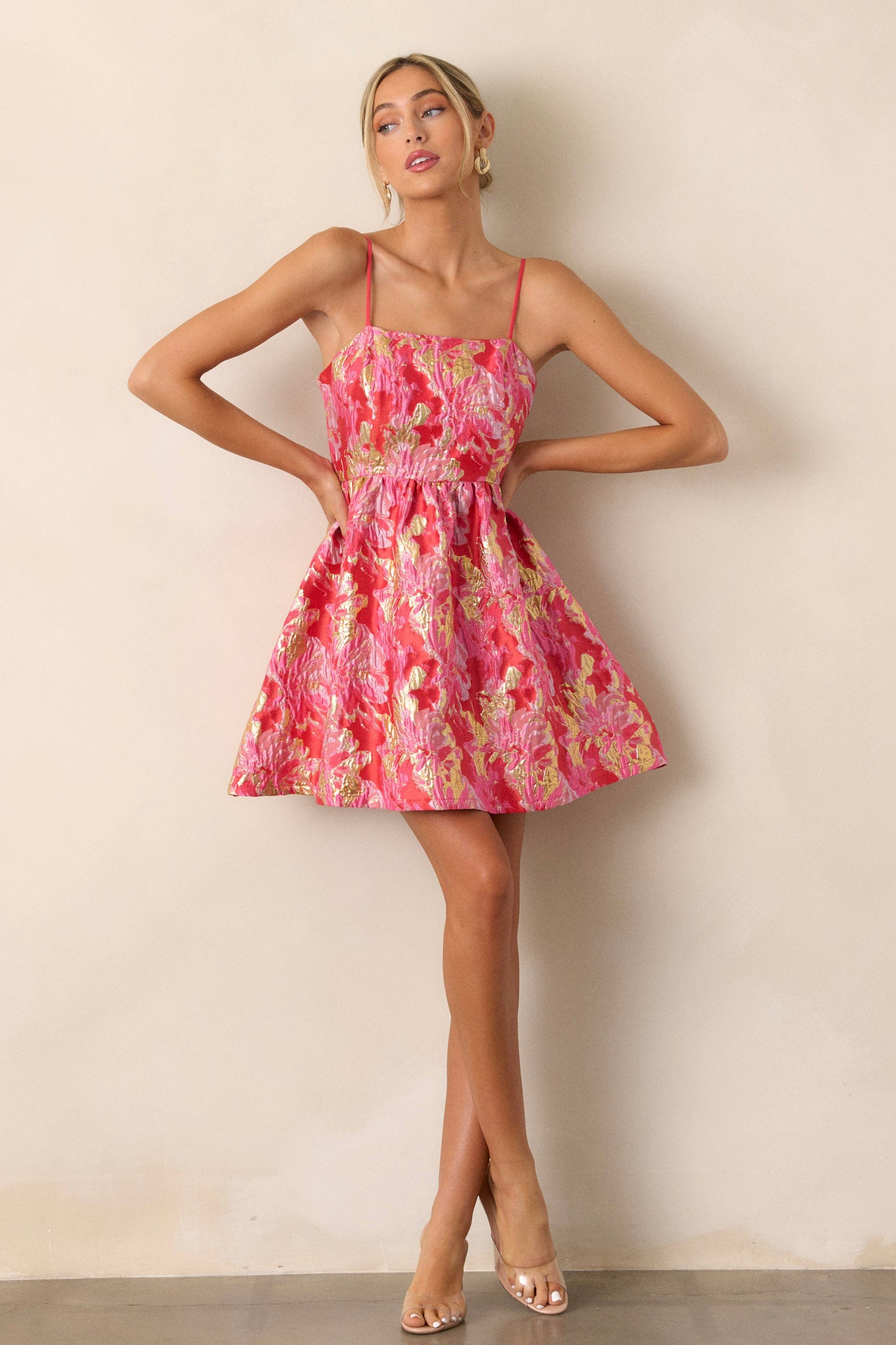 Front view of a pink jacquard dress, showcasing the adjustable straps and detailed floral jacquard fabric.