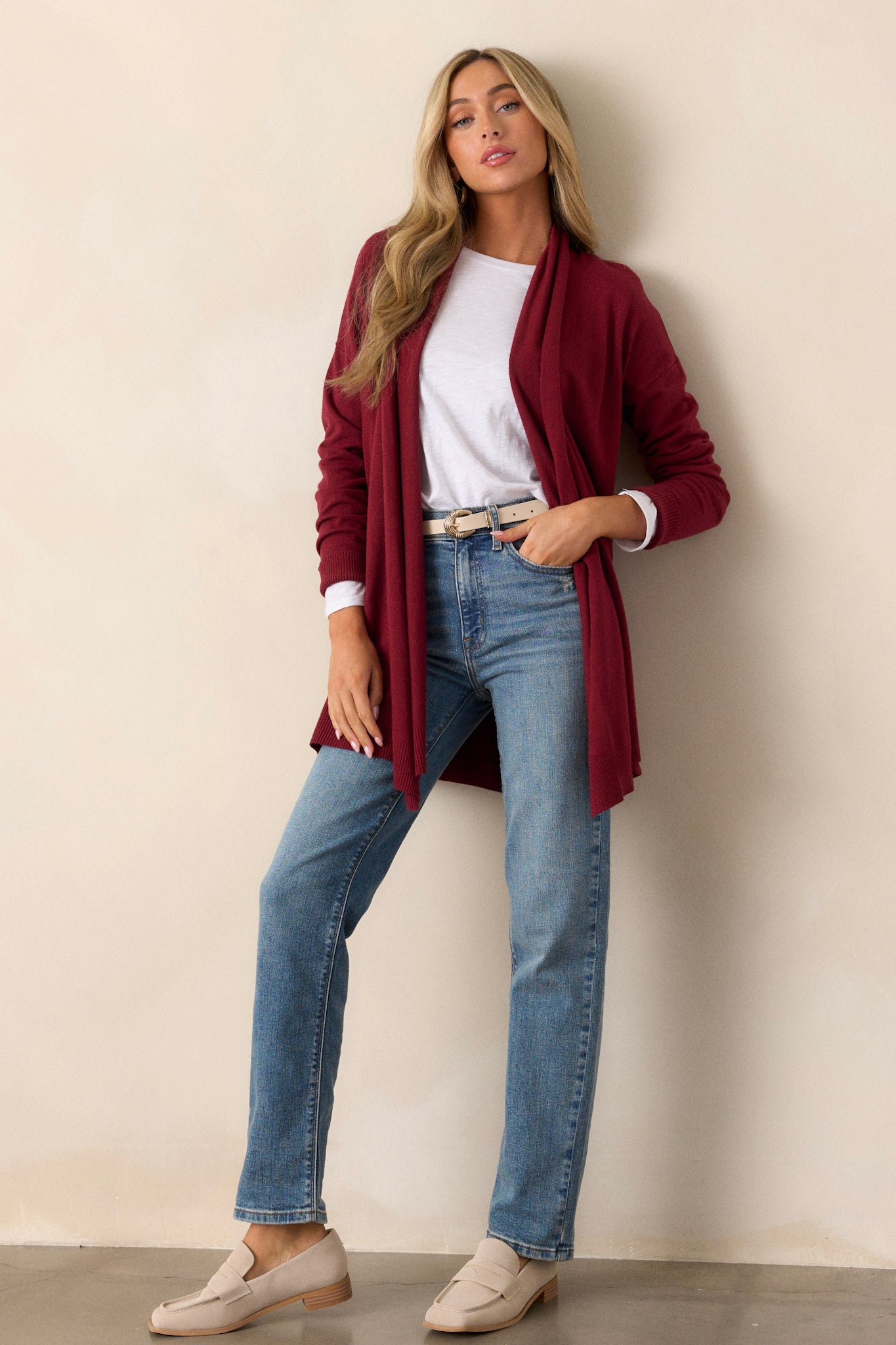 Full length view of a cardigan featuring a large slouchy folded collar, ribbed fitted cuffs, and ribbed hemline details