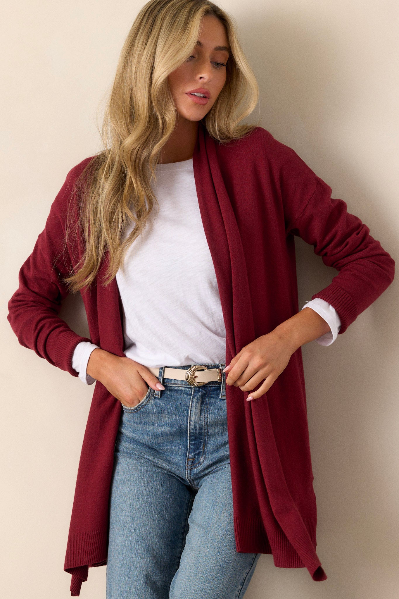 Front angled view of the cardigan showcasing the large slouchy folded collar, ribbed fitted cuffs, and ribbed hemline details