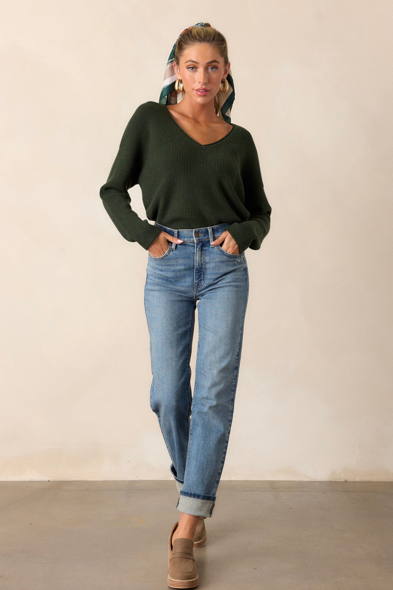 Action shot of straight leg jeans displaying the fit and movement of the denim, highlighting the high waisted design, functional pockets, and straight leg cut.