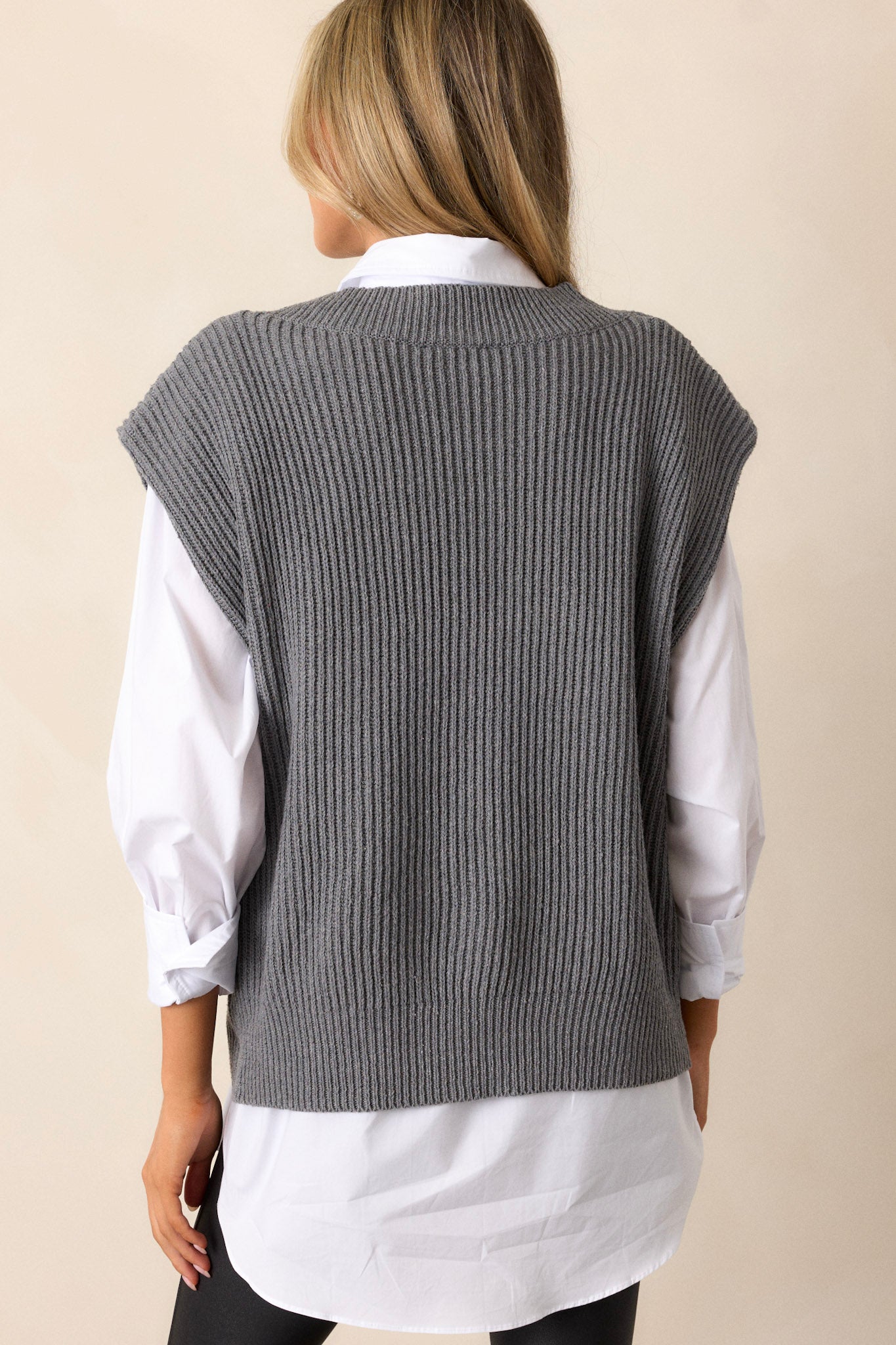 A rear view of the vest, displaying the smooth and uninterrupted back design, with the relaxed fit giving it a loose and comfortable appearance.