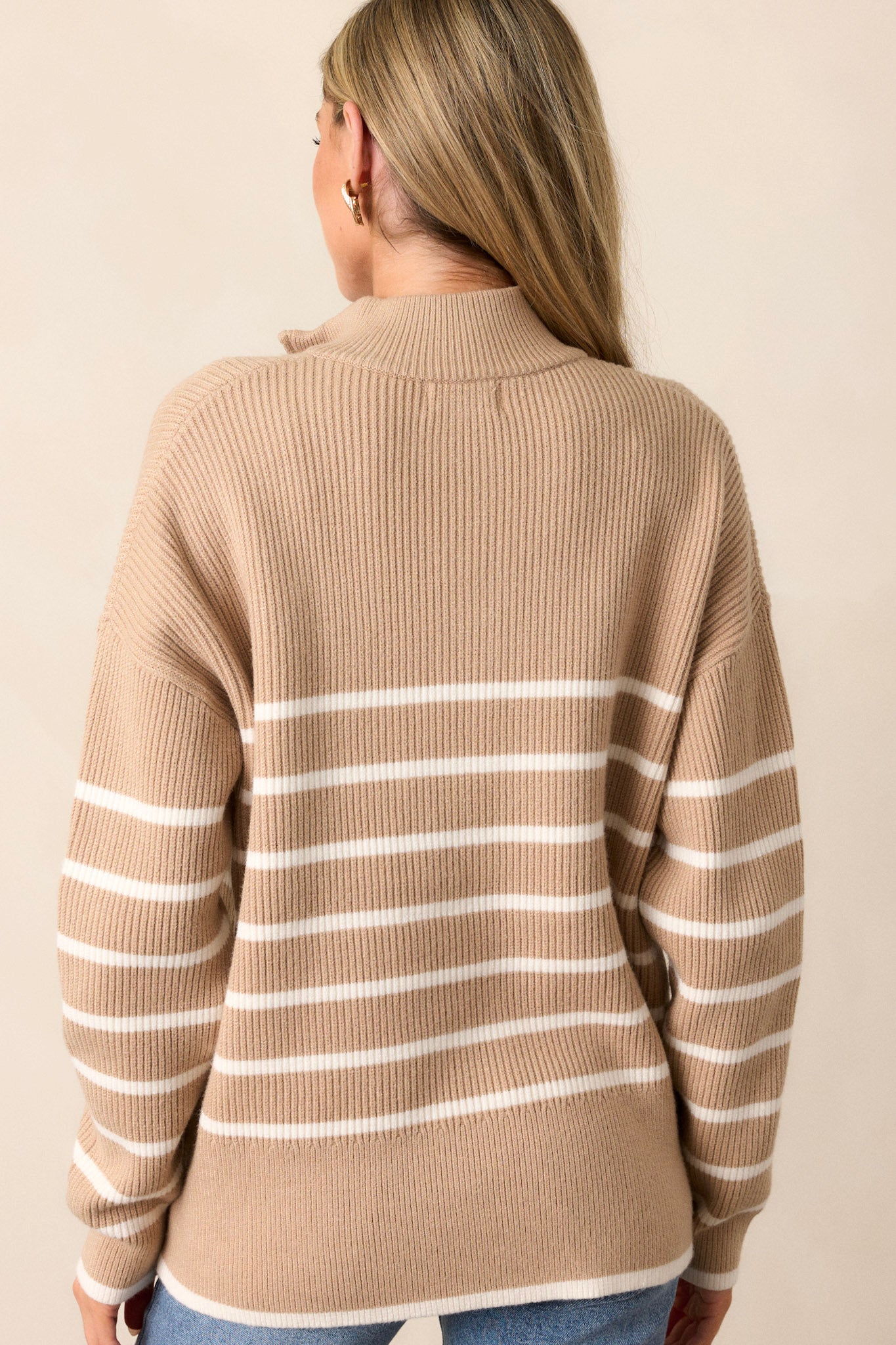 Back view of the playful garment highlighting the khaki stripe design and the soft knit texture.