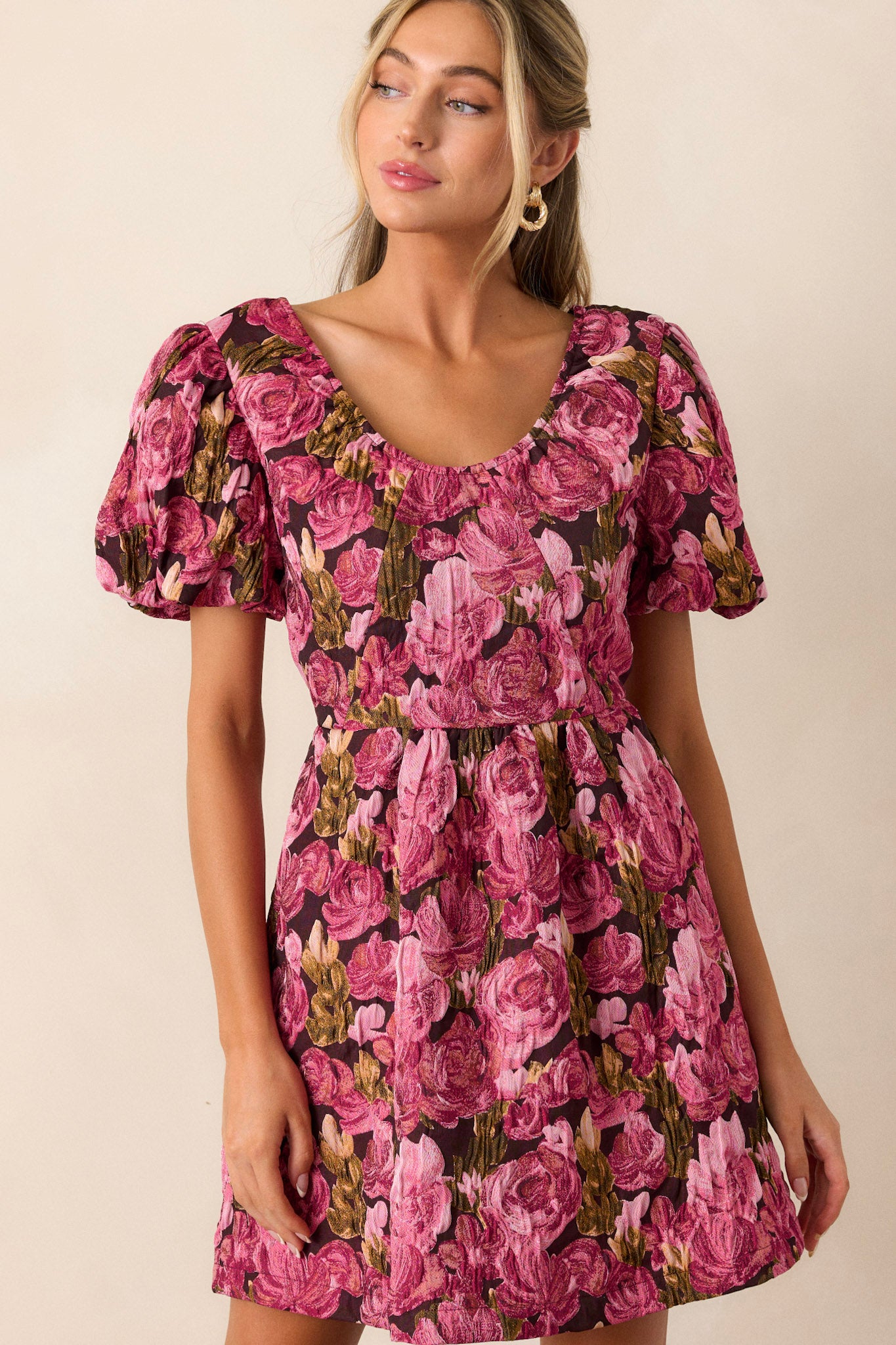 Front view of this berry dress that features a v-neckline, elastic puff sleeves, a floral jacquard fabric, and a back zipper.