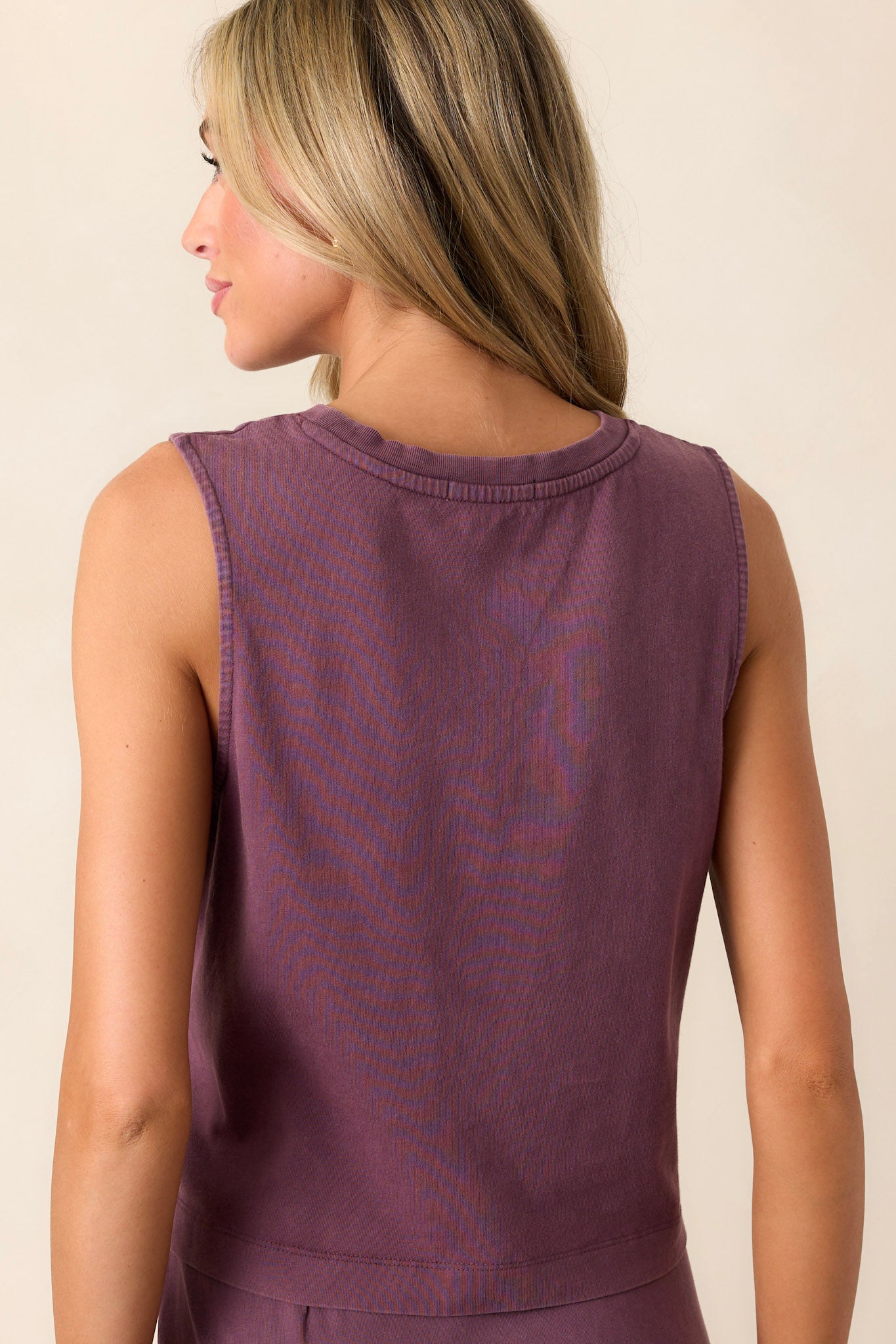 Back view of the cocoa berry jersey tank highlighting the high back and the smooth finish of the cropped design.