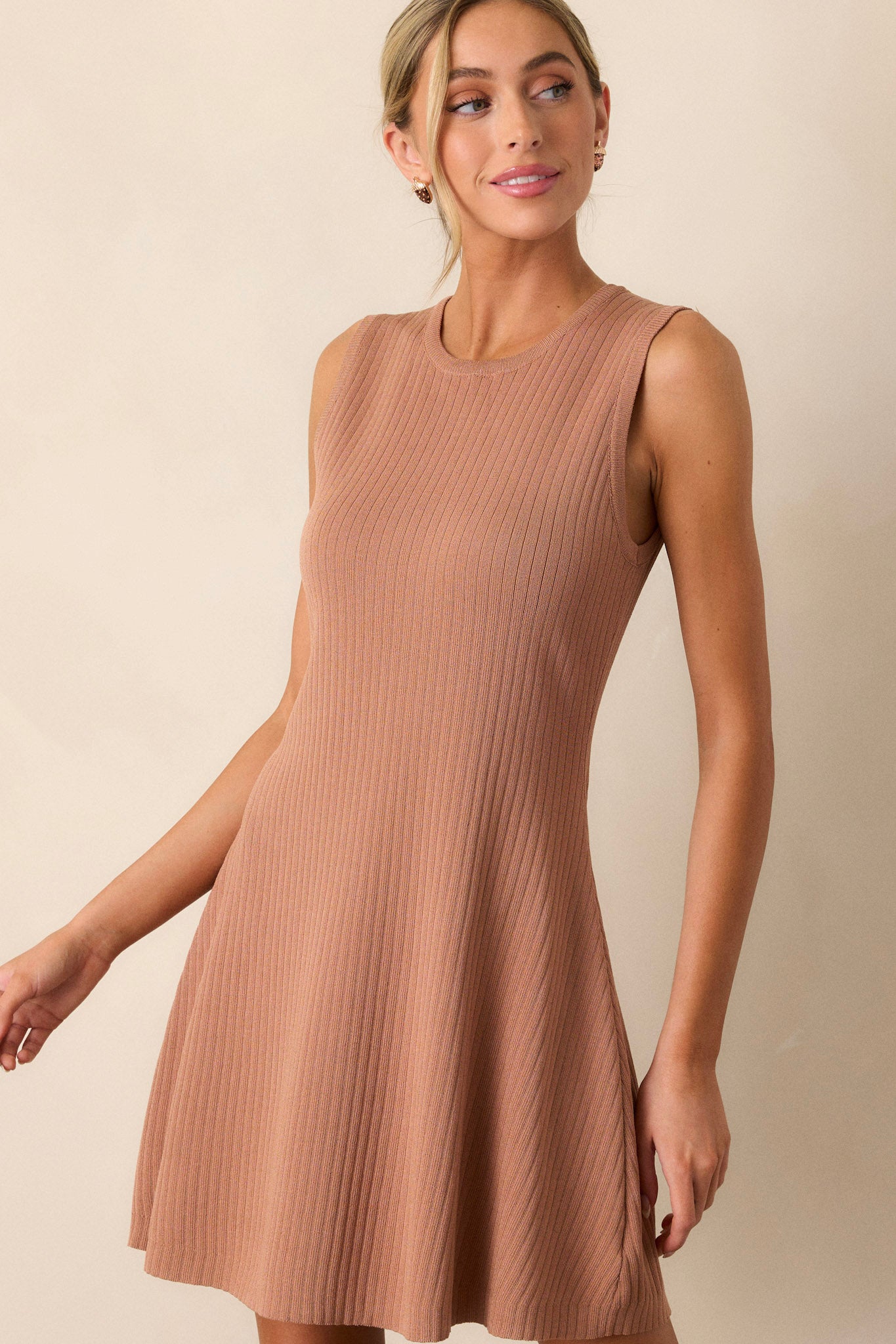 A cropped view of the flare at the hem, emphasizing the flow and movement of the fabric.