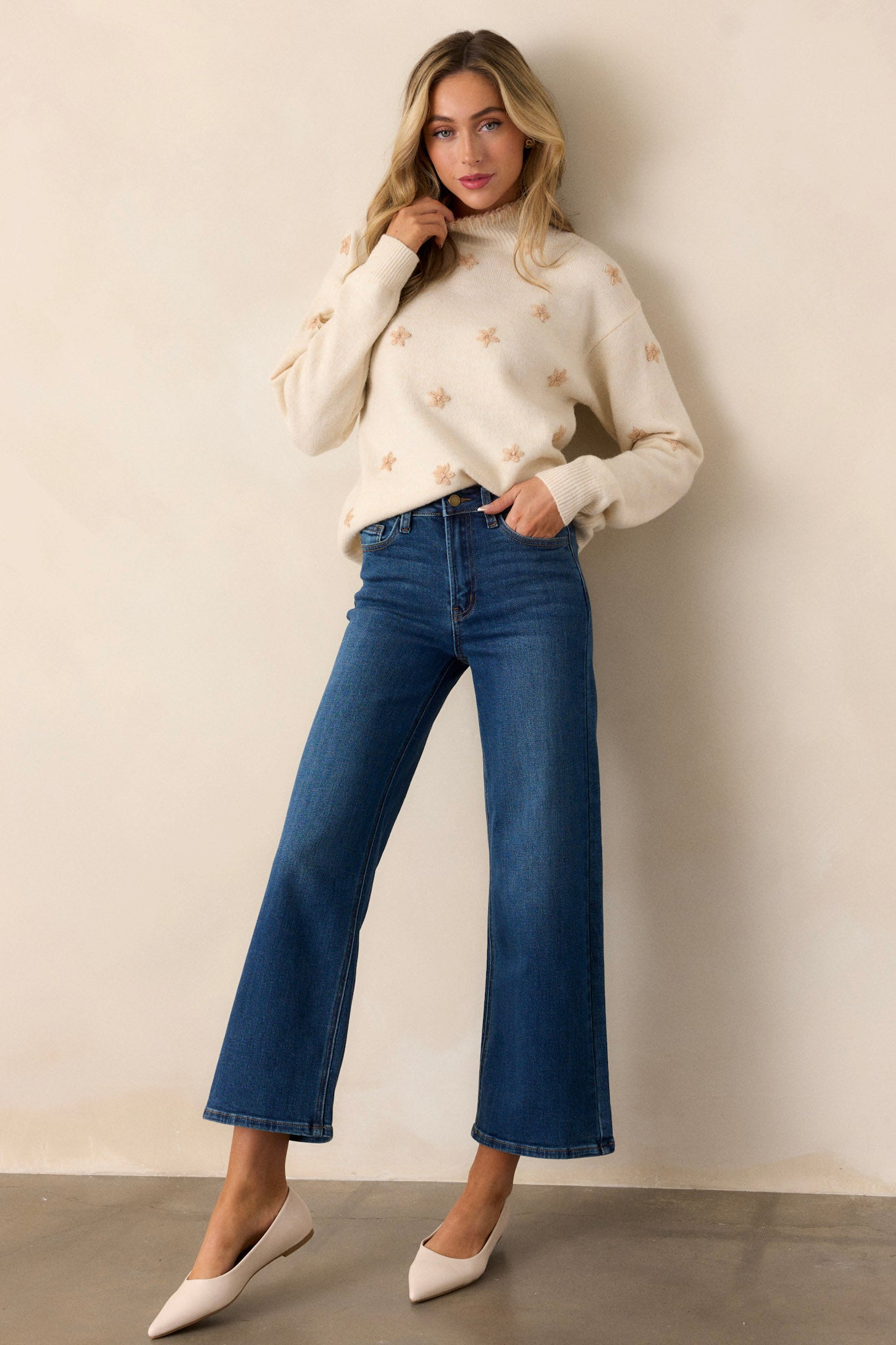 Full body view of dark wash jeans featuring a high waisted design, classic button & zipper closure, belt loops, functional front & back pockets, and a cropped length.