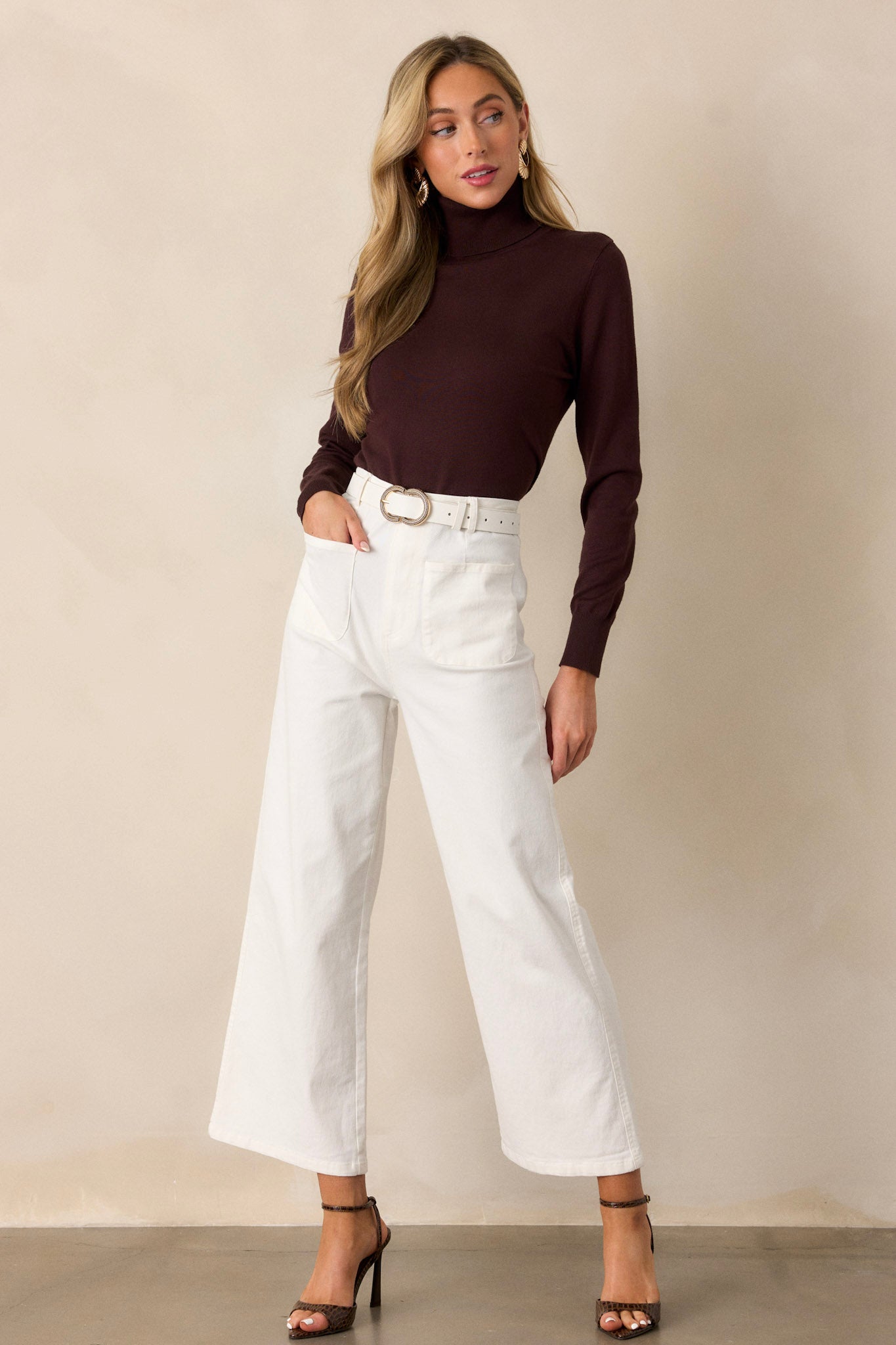 These ivory jeans feature a high waisted design, classic button & zipper closure, belt loops, functional front pockets, faux back pockets, and a wide leg design.