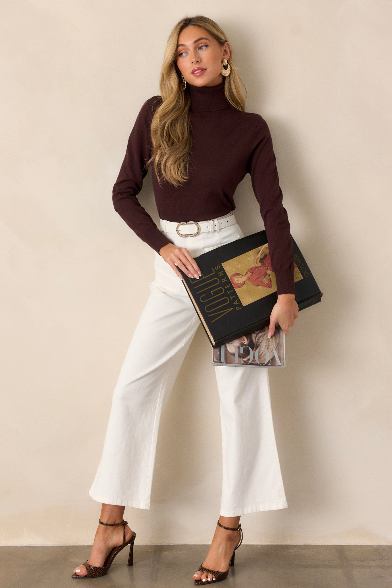 Full length view of ivory jeans with a high waisted design, classic button & zipper closure, belt loops, functional front pockets, faux back pockets, and a wide leg design