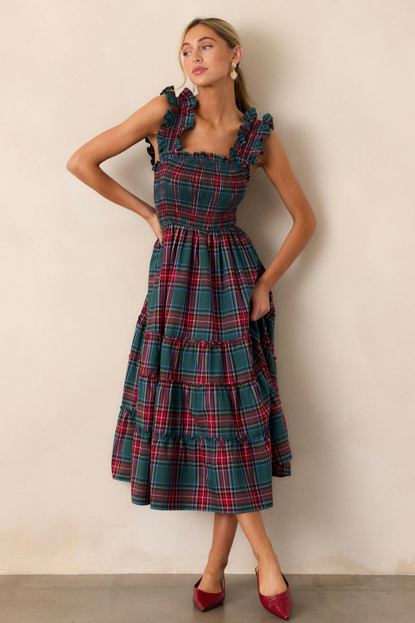 Full body view of this dress that showcases a plaid pattern in shades of red and green.