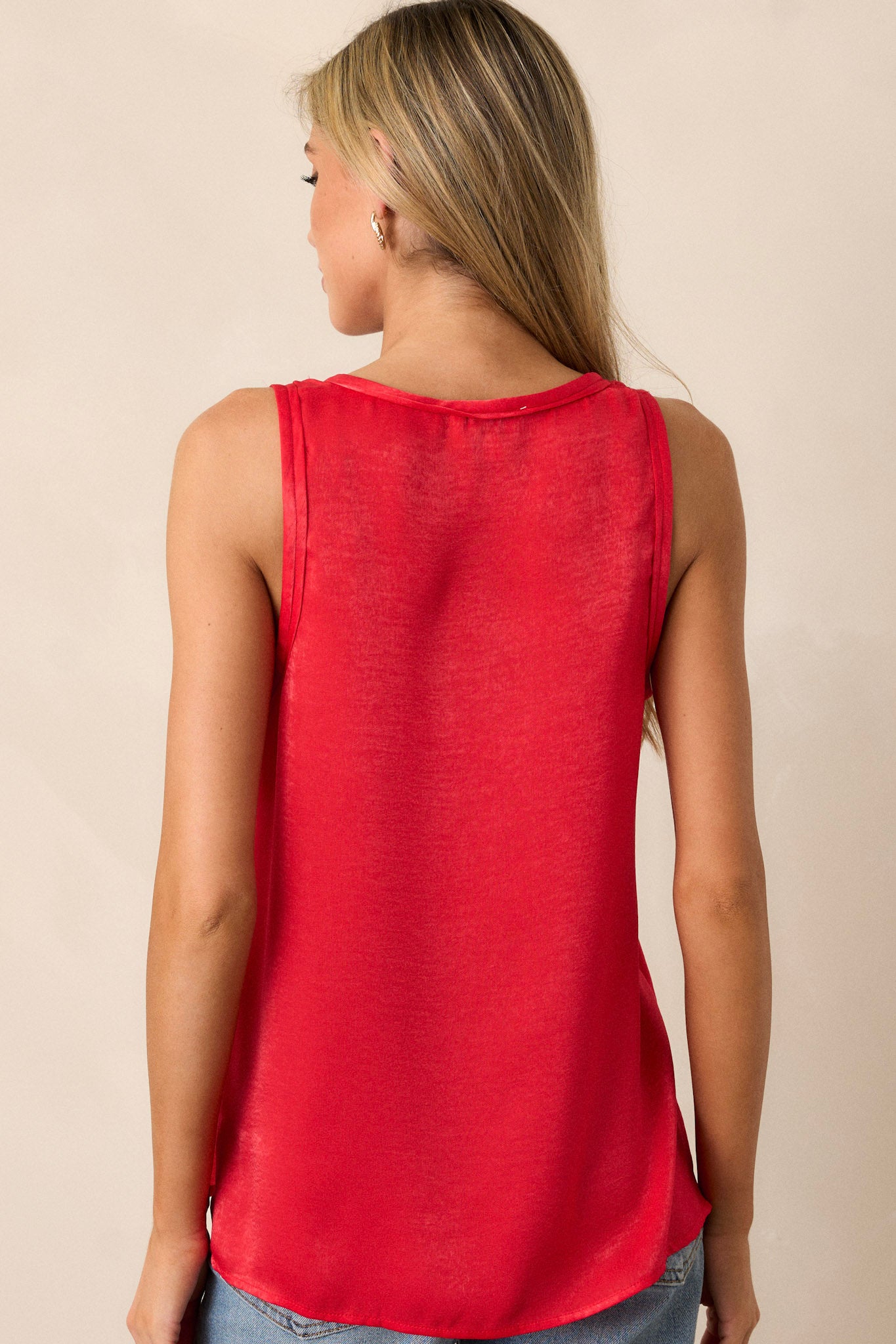 Back view of the tank top highlighting the slits up the sides of the bottom hem and the lightweight fabric.