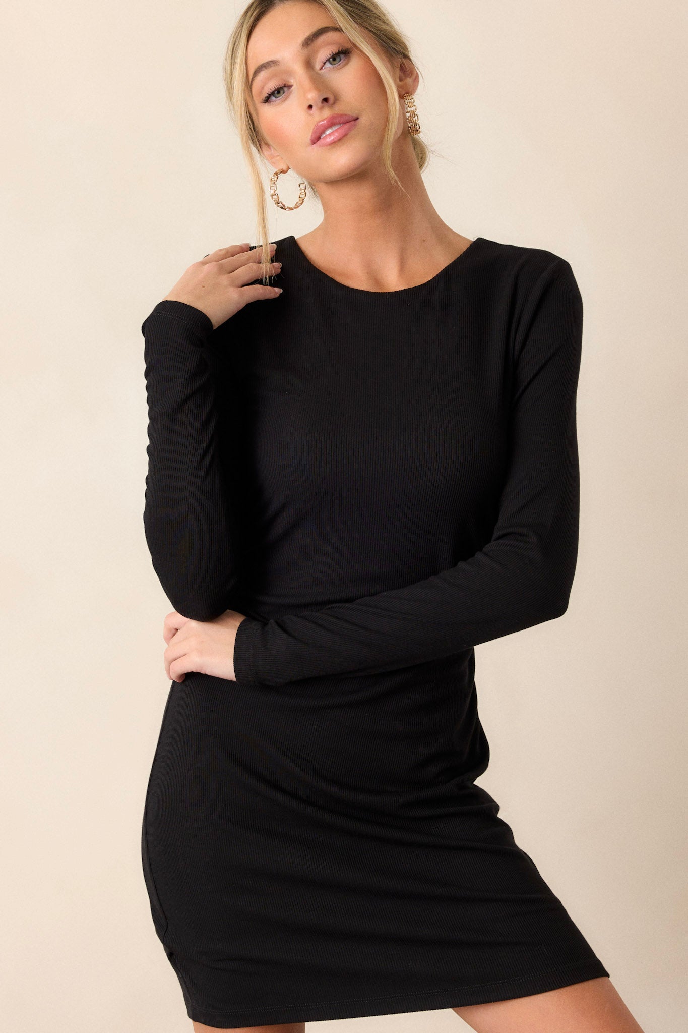 A close-up of the long sleeves, emphasizing the ribbed texture and the snug, fitted design around the arms.