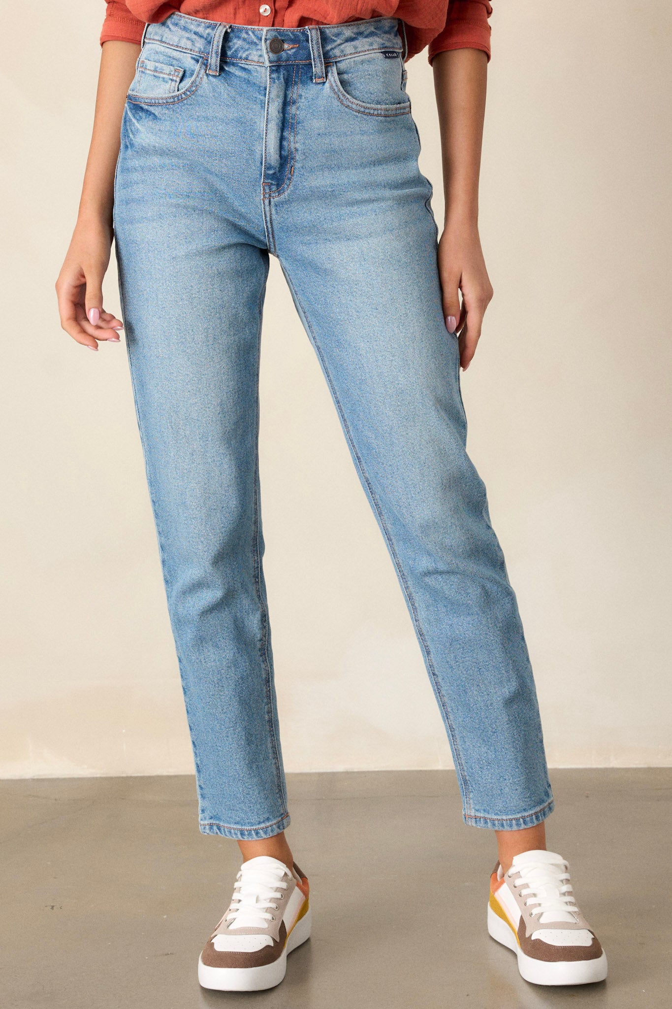 These medium wash straight leg jeans feature 5-pocket detailing and a standard zipper and button closure.