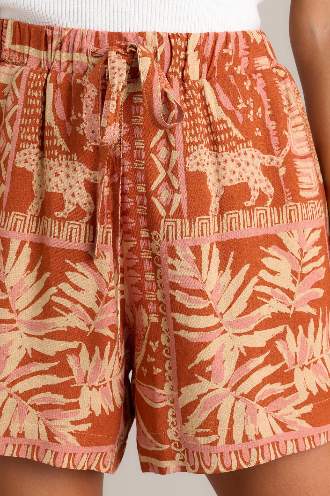 Close-up of the sienna rose shorts showing the high waisted design, self-tie drawstring, and functional hip pockets.