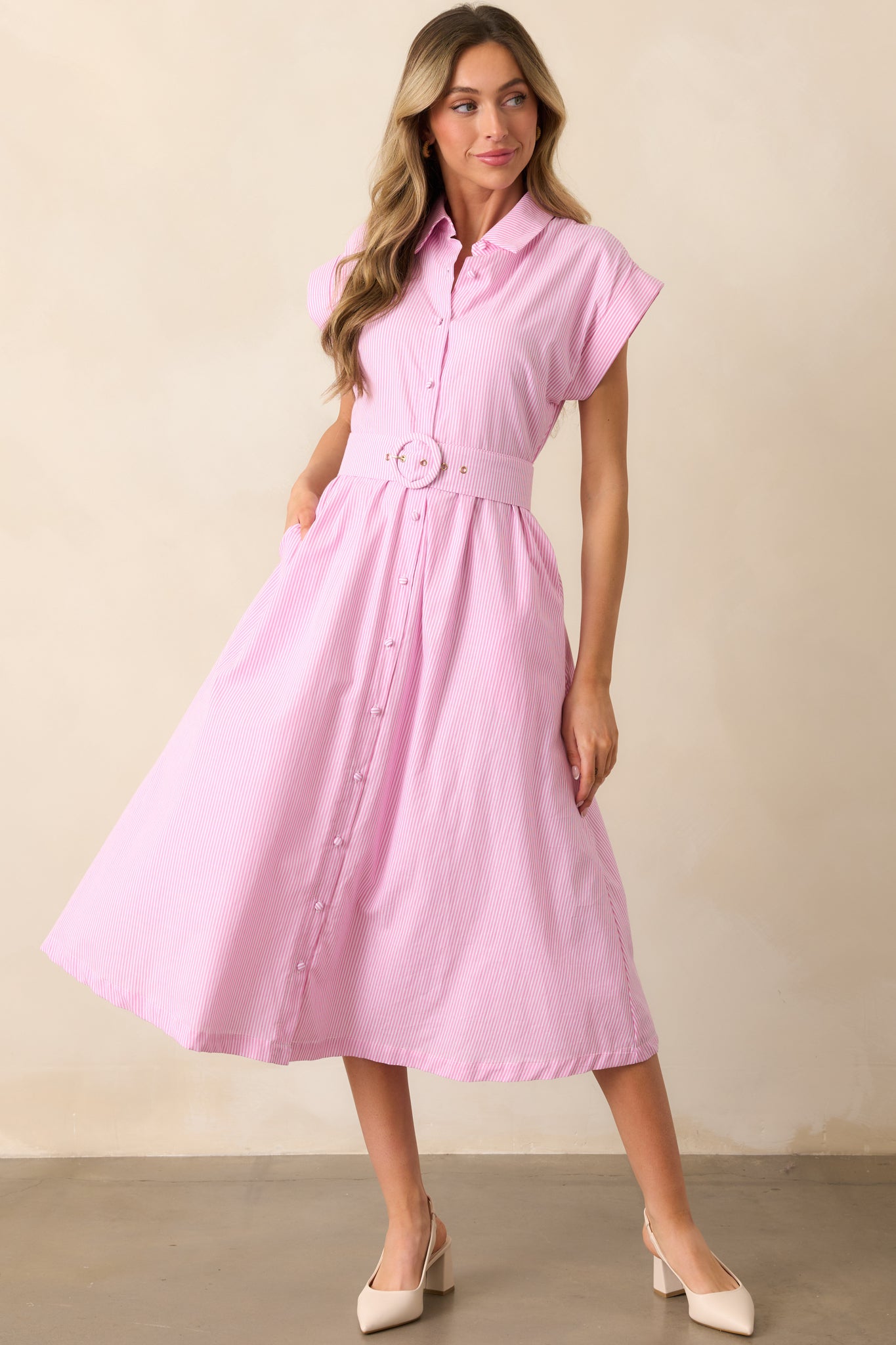 A front-facing view of the peony pink dress, showcasing its collared neckline and structured silhouette.