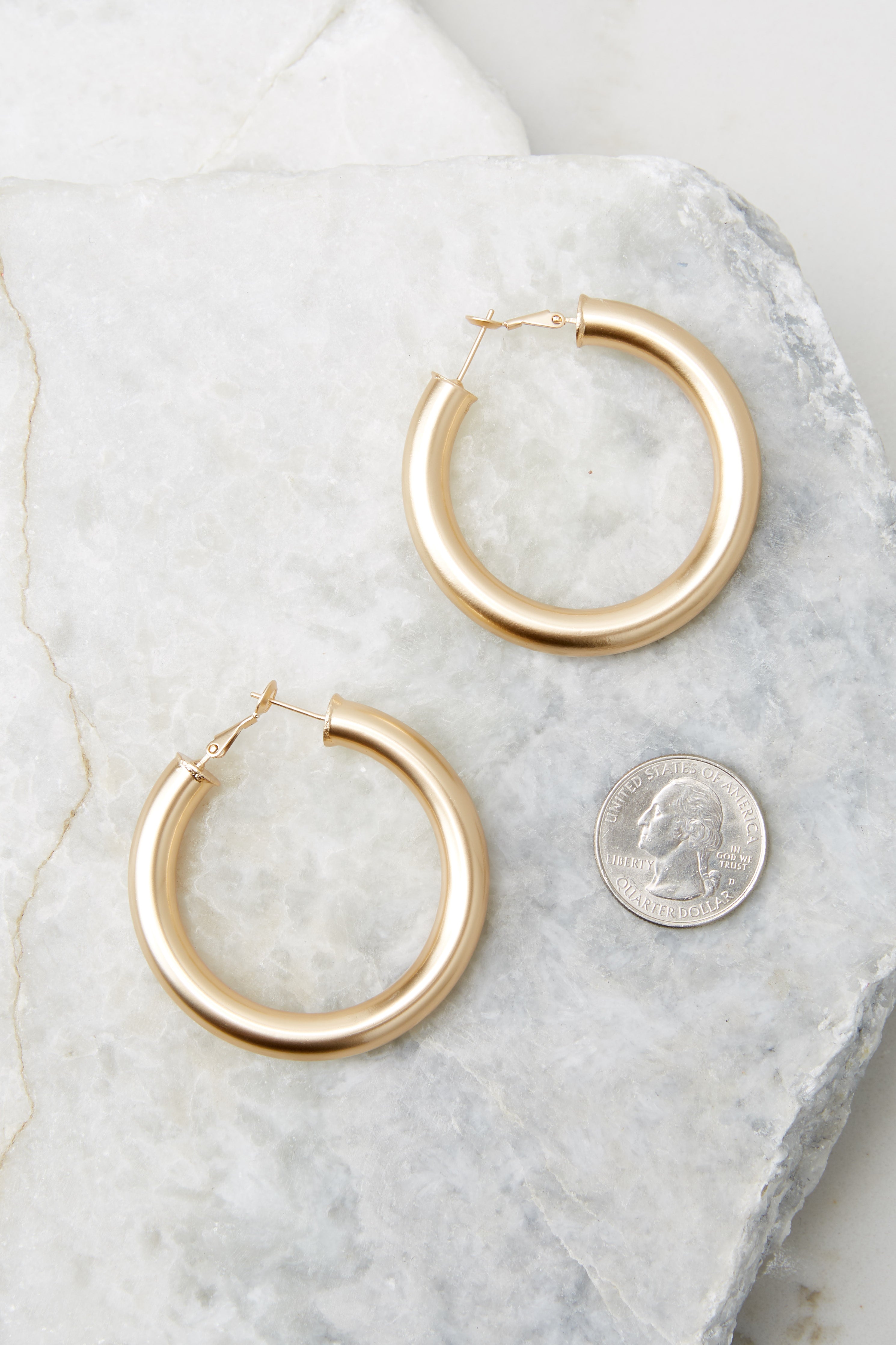Size comparison of these Chunky medium-sized hoops with a smooth matte finish
