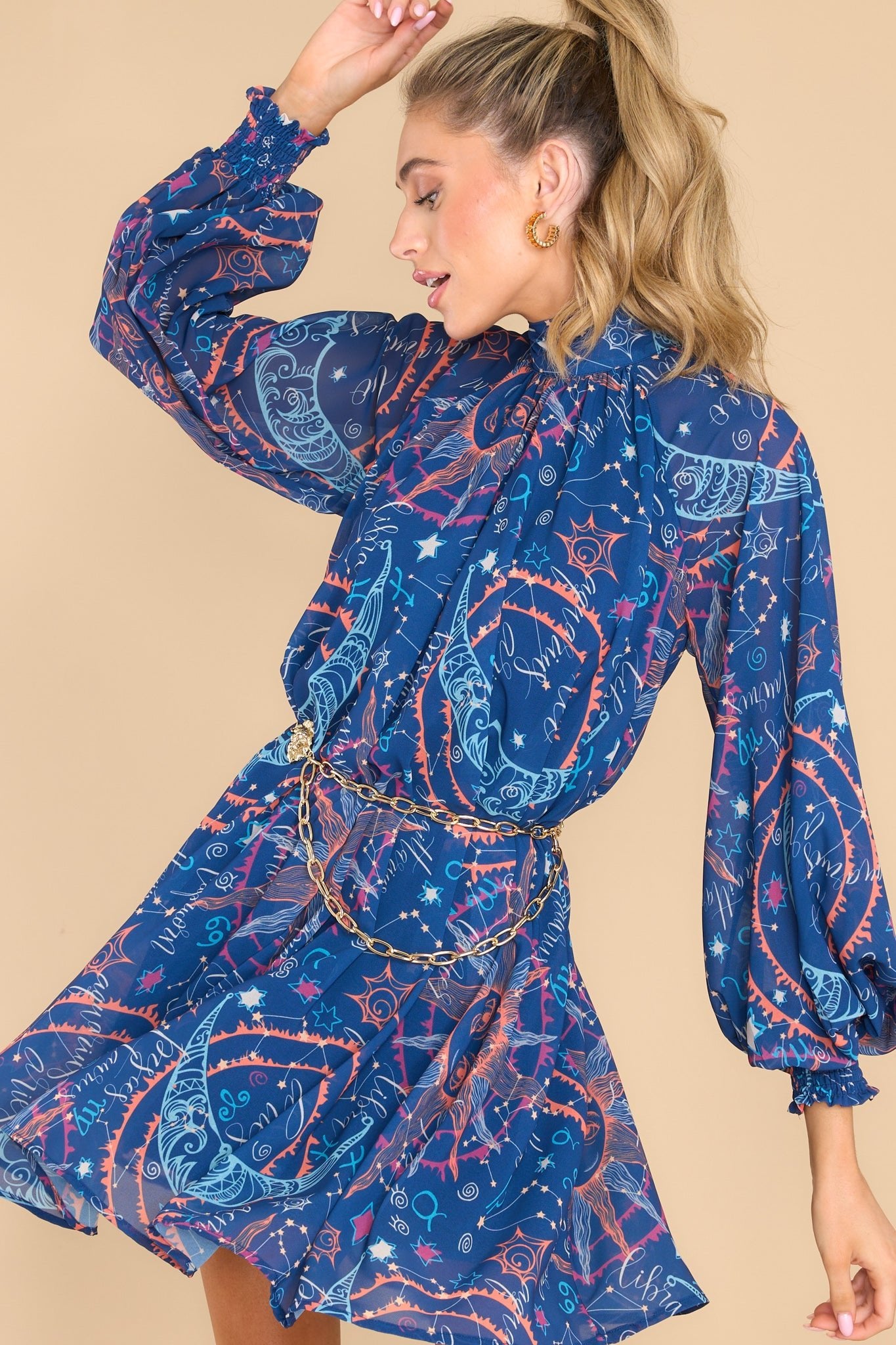Front view of this dress that showcases the movement of the fabric in a twirling motion.