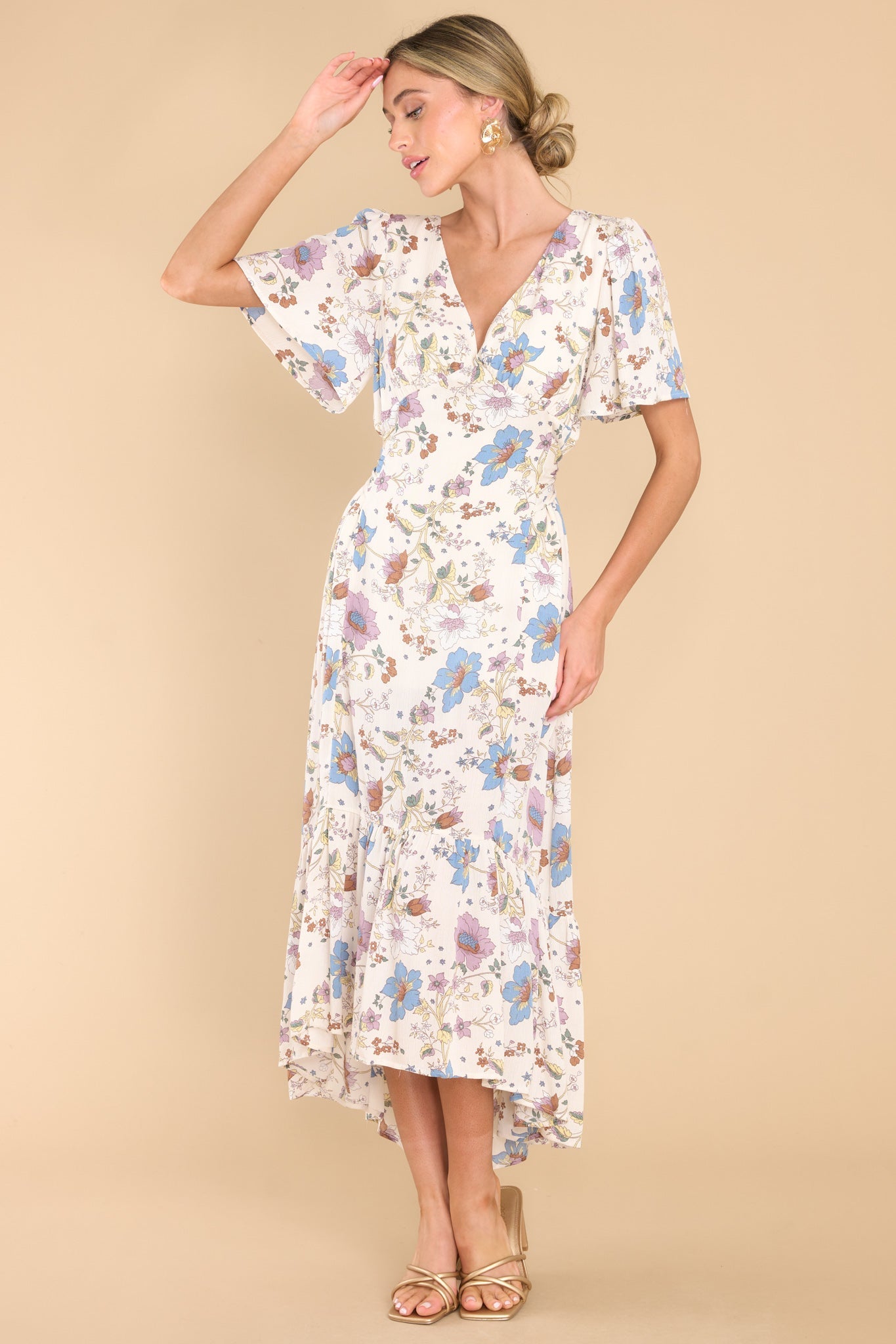 Full body view of this dress that showcases the floral print of the fabric.