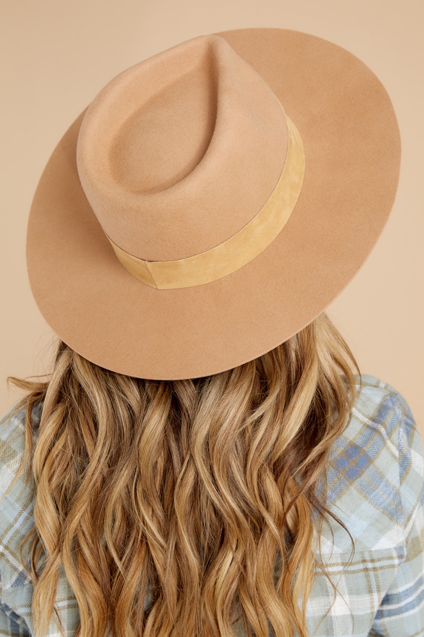 Angled back view of this hat that showcases a silhouette inspired by men's vintage styles, features a black tonal 100% suede band, with a brim measurement of 8.5 cm, a 50+ UPF rating.