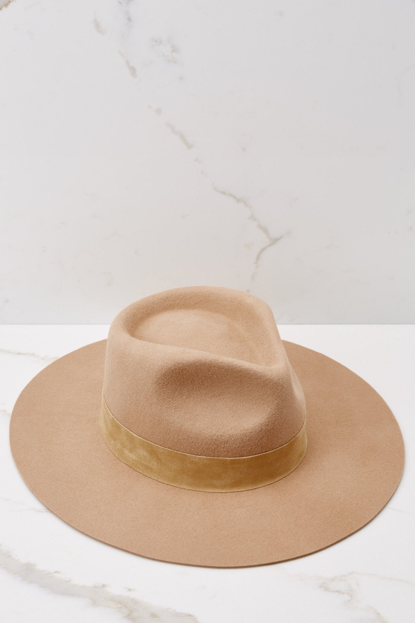 Angled top view of this hat that showcases a silhouette inspired by men's vintage styles, features a black tonal 100% suede band, with a brim measurement of 8.5 cm, a 50+ UPF rating.