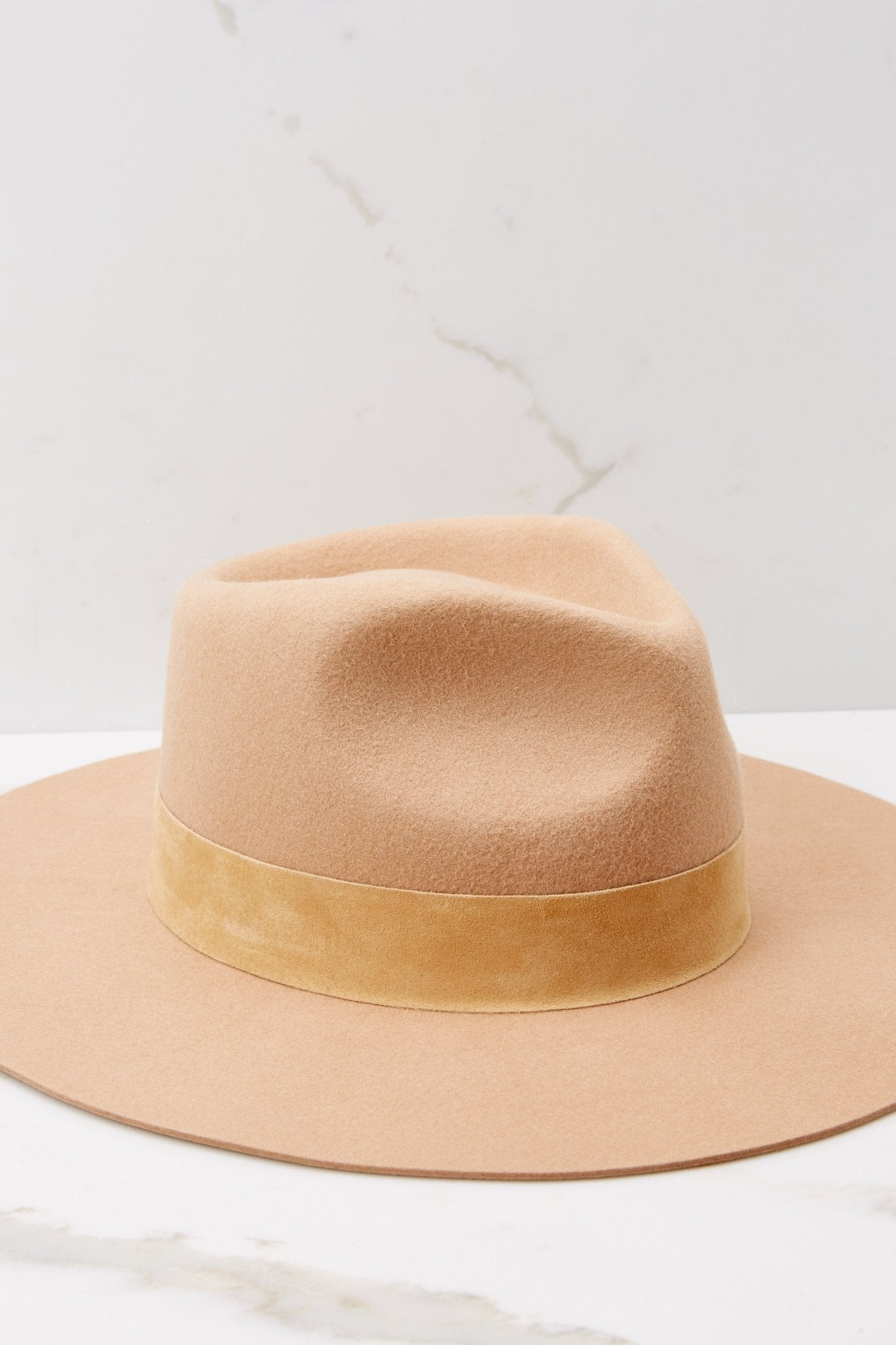 Close up view of this hat that showcases a silhouette inspired by men's vintage styles, features a black tonal 100% suede band, with a brim measurement of 8.5 cm, a 50+ UPF rating.